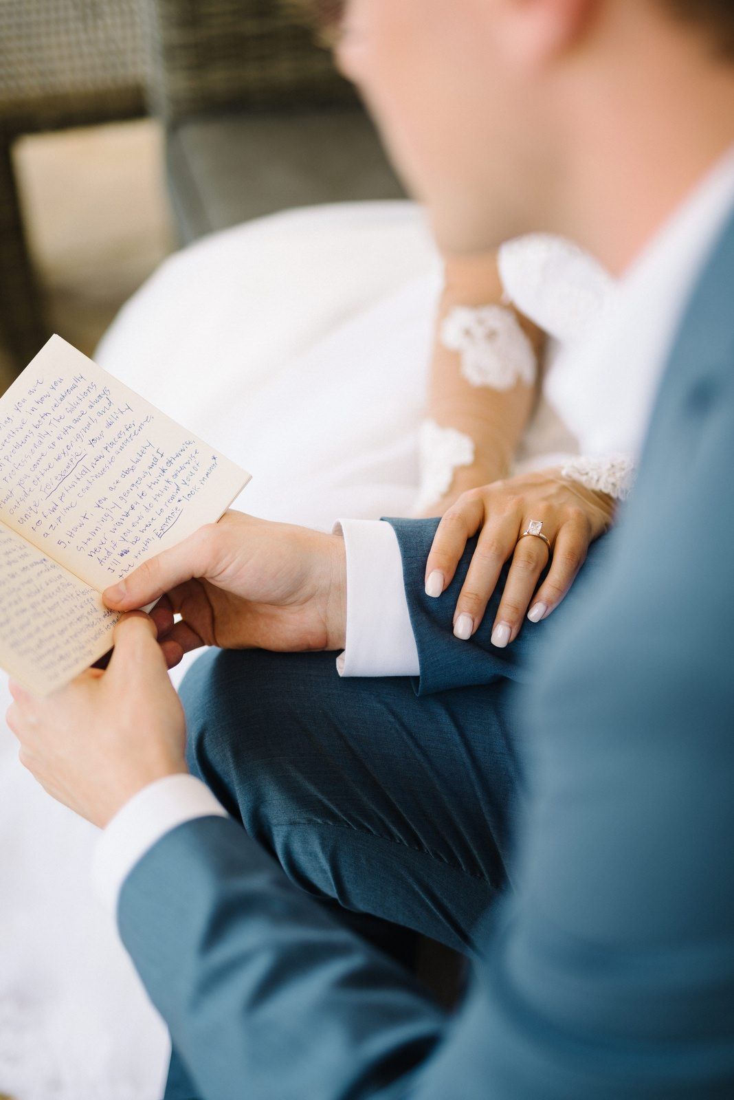 bride and groom reading their vows