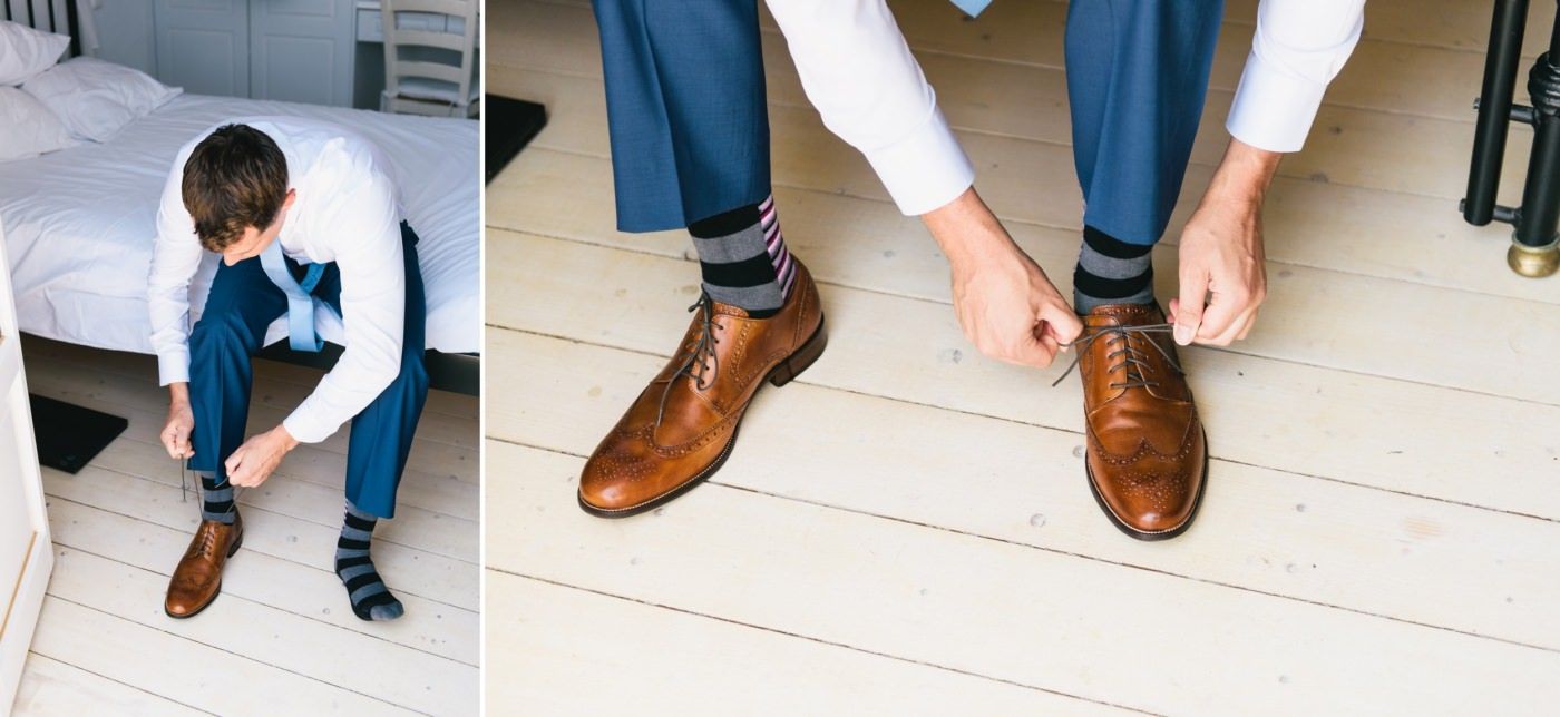 Details of brown leather dress shoes being tied on white tile floor.