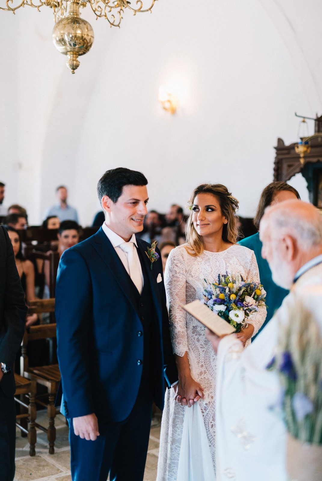 bride and groom in the church at folegandros