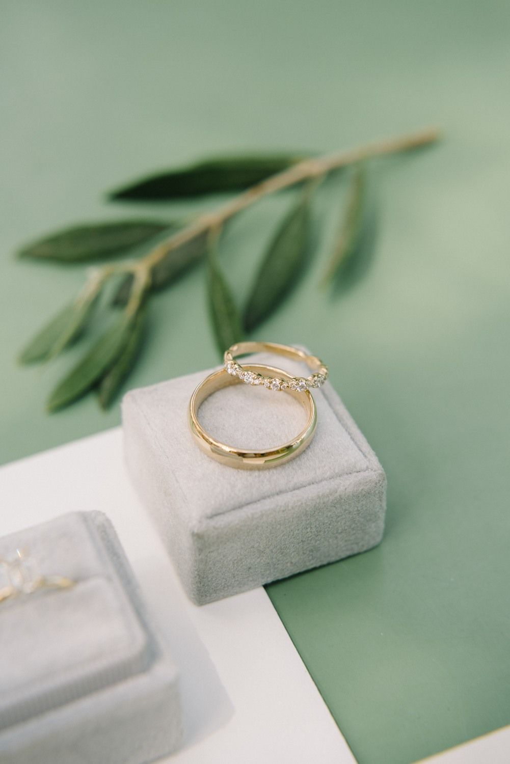 wedding stationery and engagement ring with olive green background details