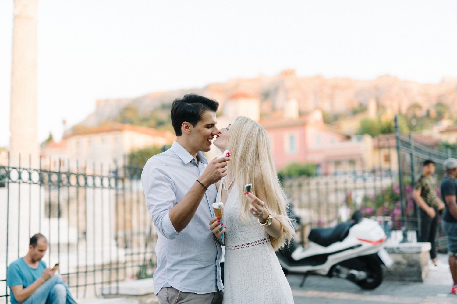 couple walking and eating ice cream in monastiraki athens