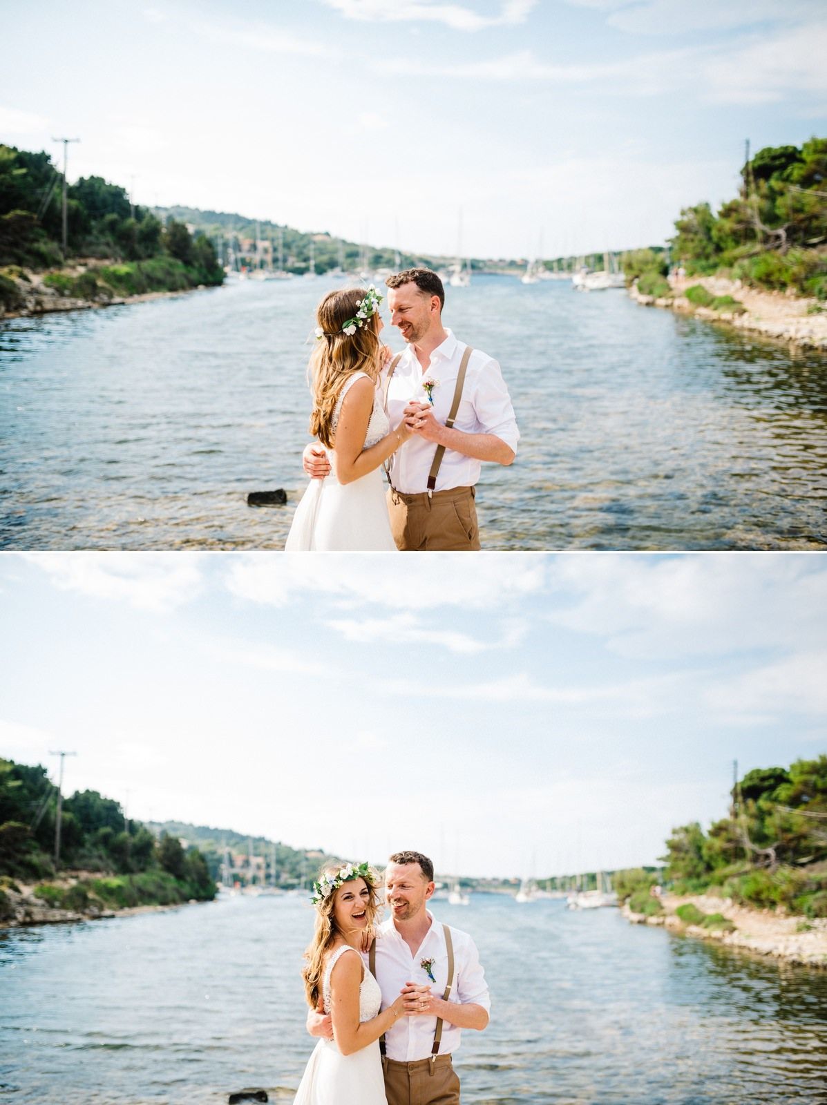Newlyweds share intimate moment by Mediterranean waters with boats in background.