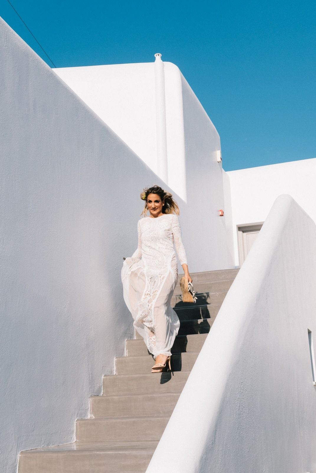 bride is getting ready for her wedding in folegandros
