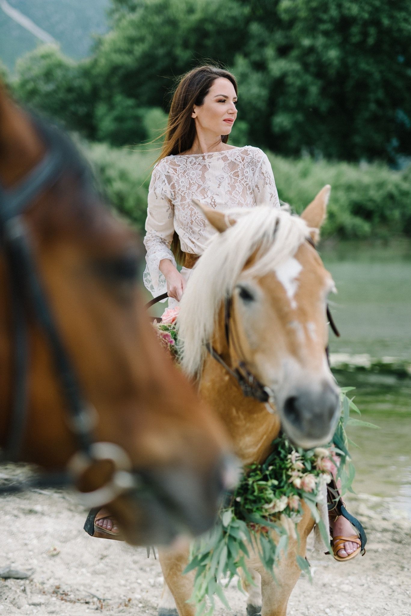 portrait of bride riding a horse in acheron river in greece