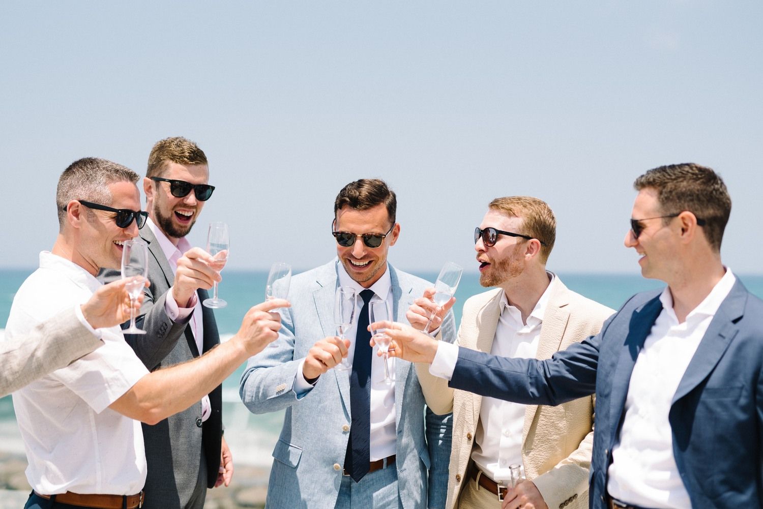 groomens having fun and say cheers
