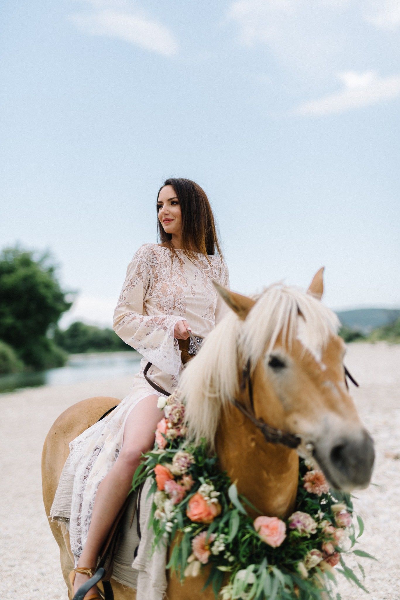 bride riding horse in acheron river in greece