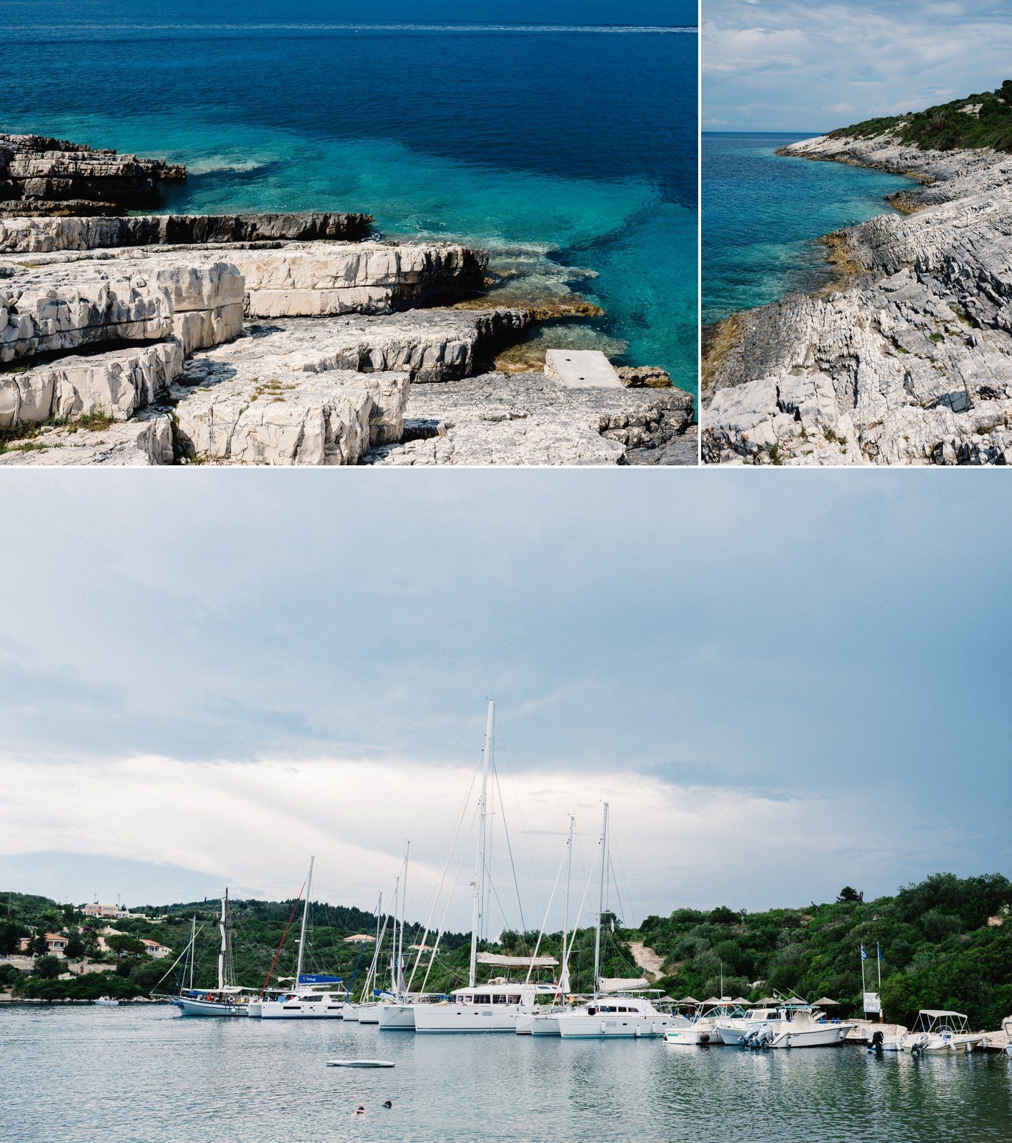 Rocky coastal landscape with turquoise waters and marina filled with sailboats.
