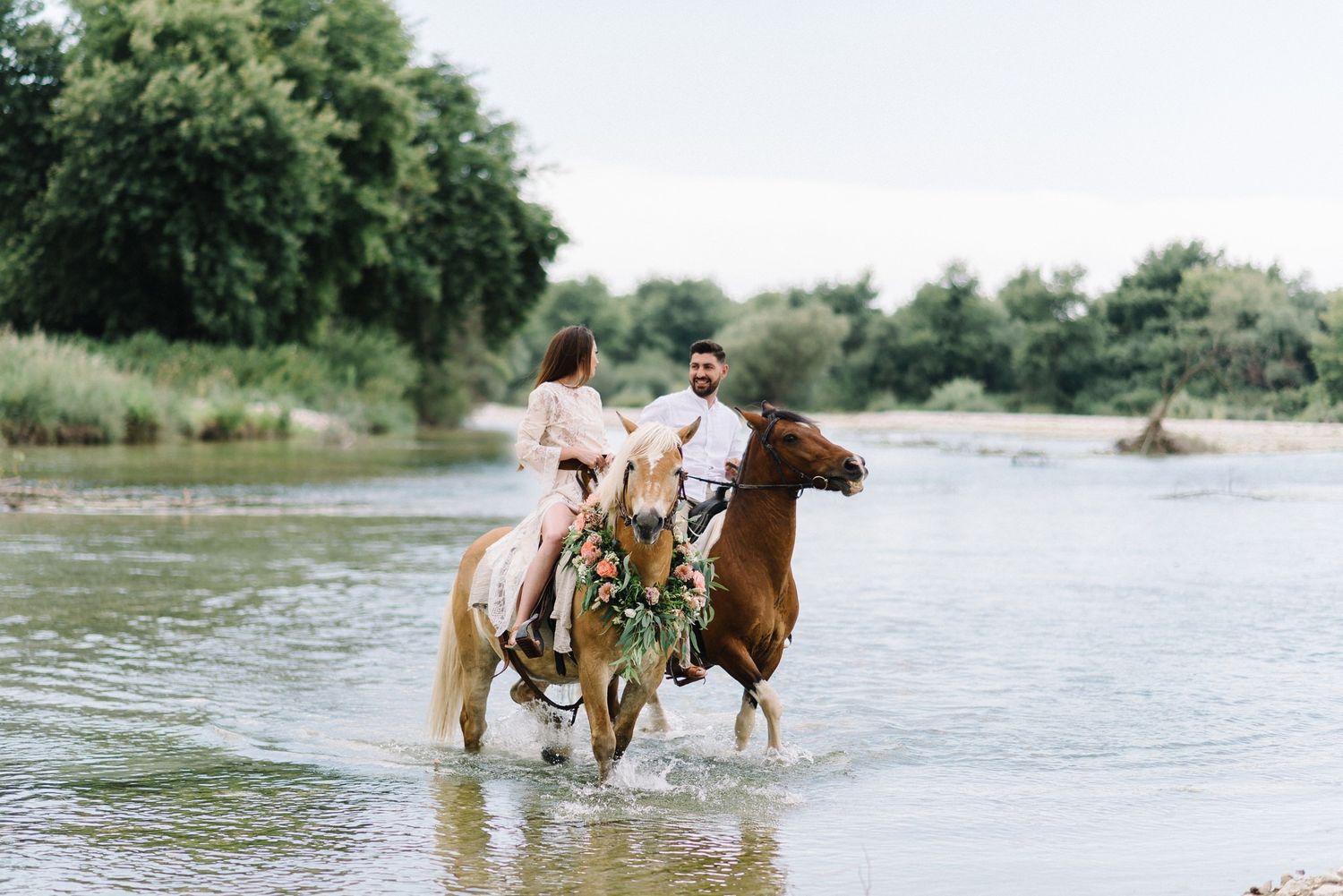couple engagement shooting riding horses in acheron river greece