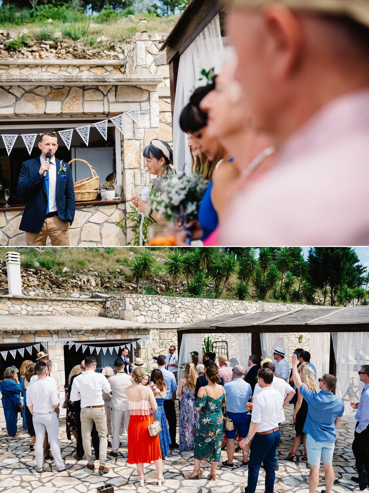 Wedding guests gather at a rustic stone venue decorated with bunting flags for an outdoor celebration.