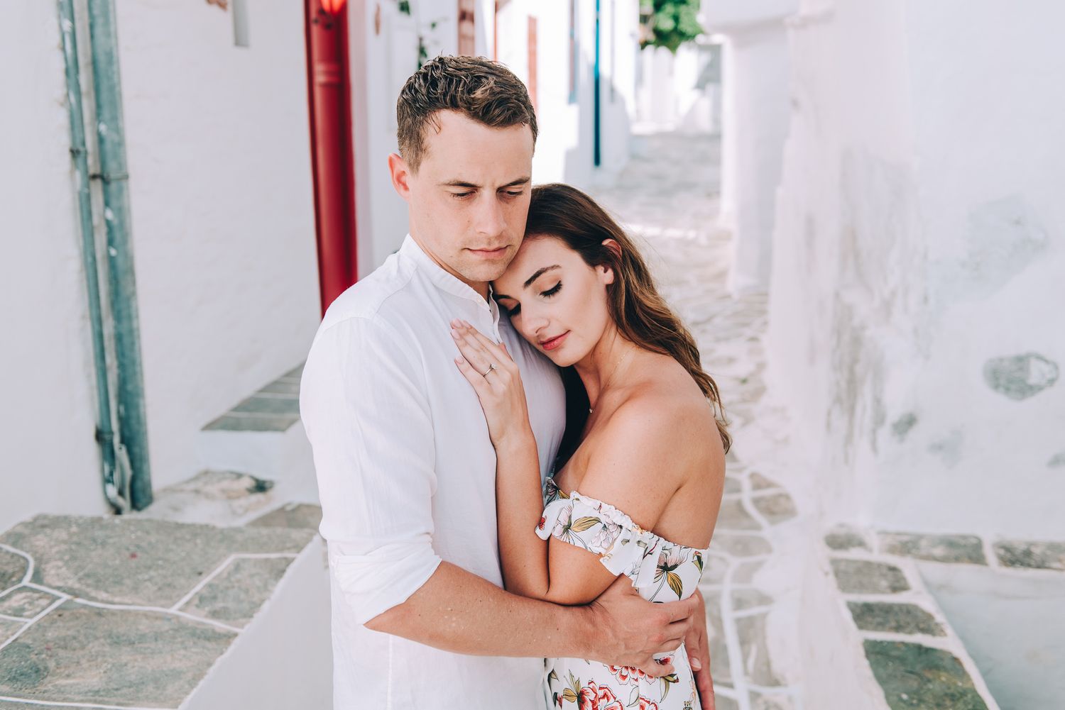 the couple is hugging at kastro in sifnos island