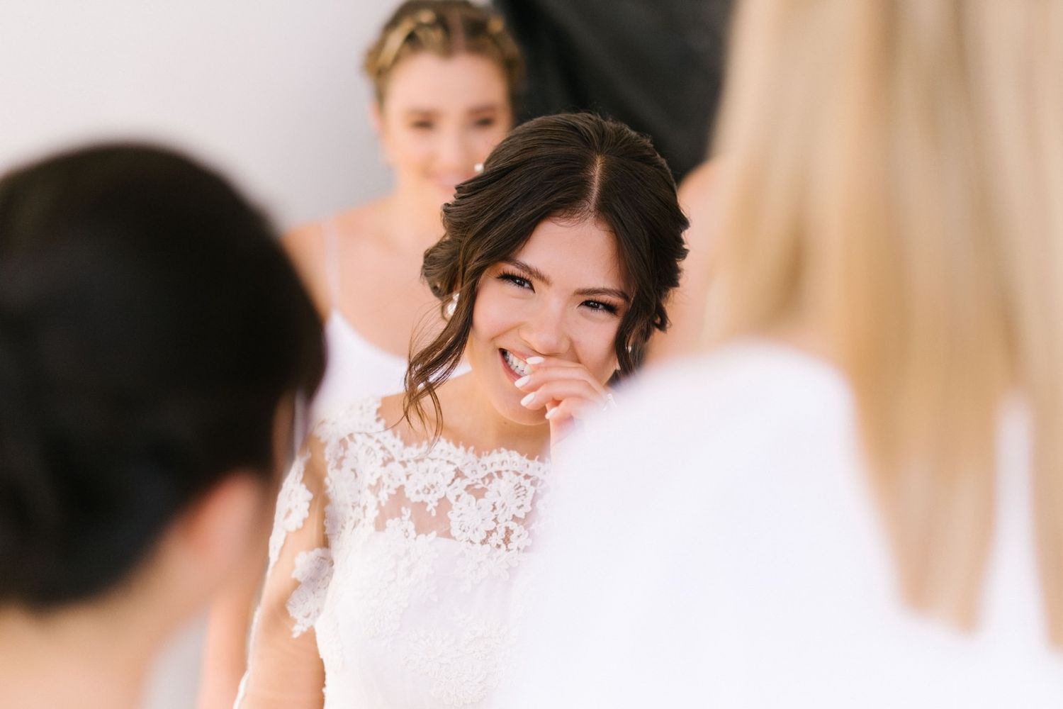 Candid moment of laughter during a wedding celebration.