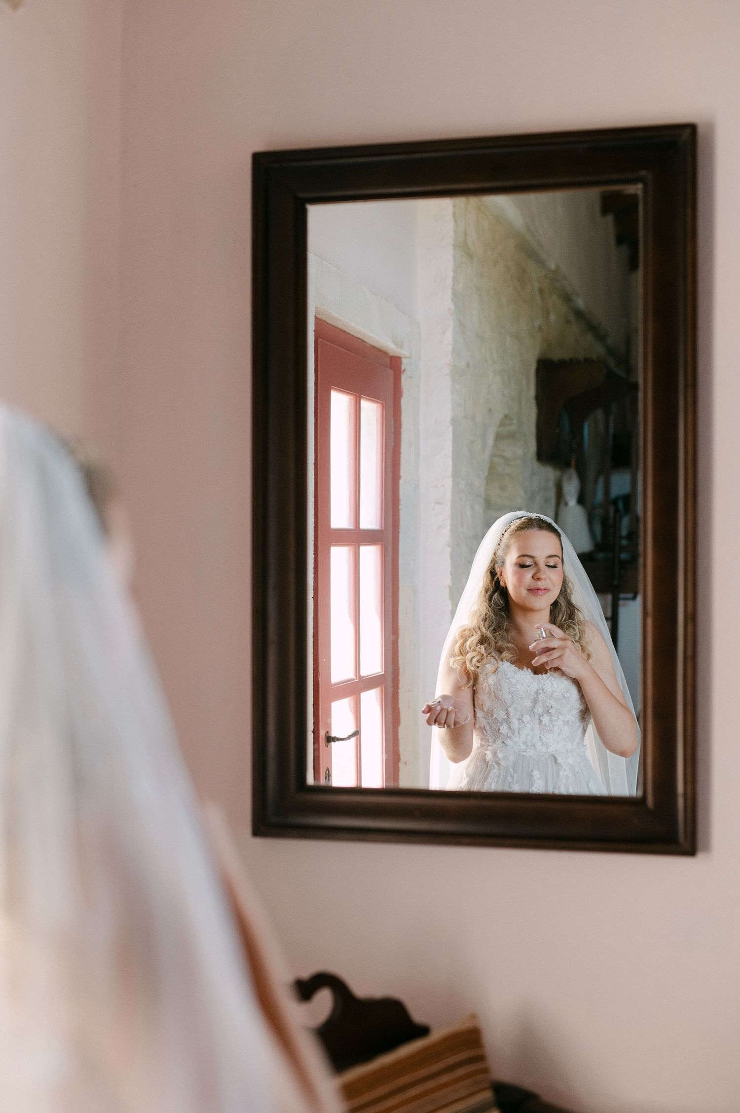 A mirror sequence shows a person in bridal attire viewed from different angles in a light-filled room.