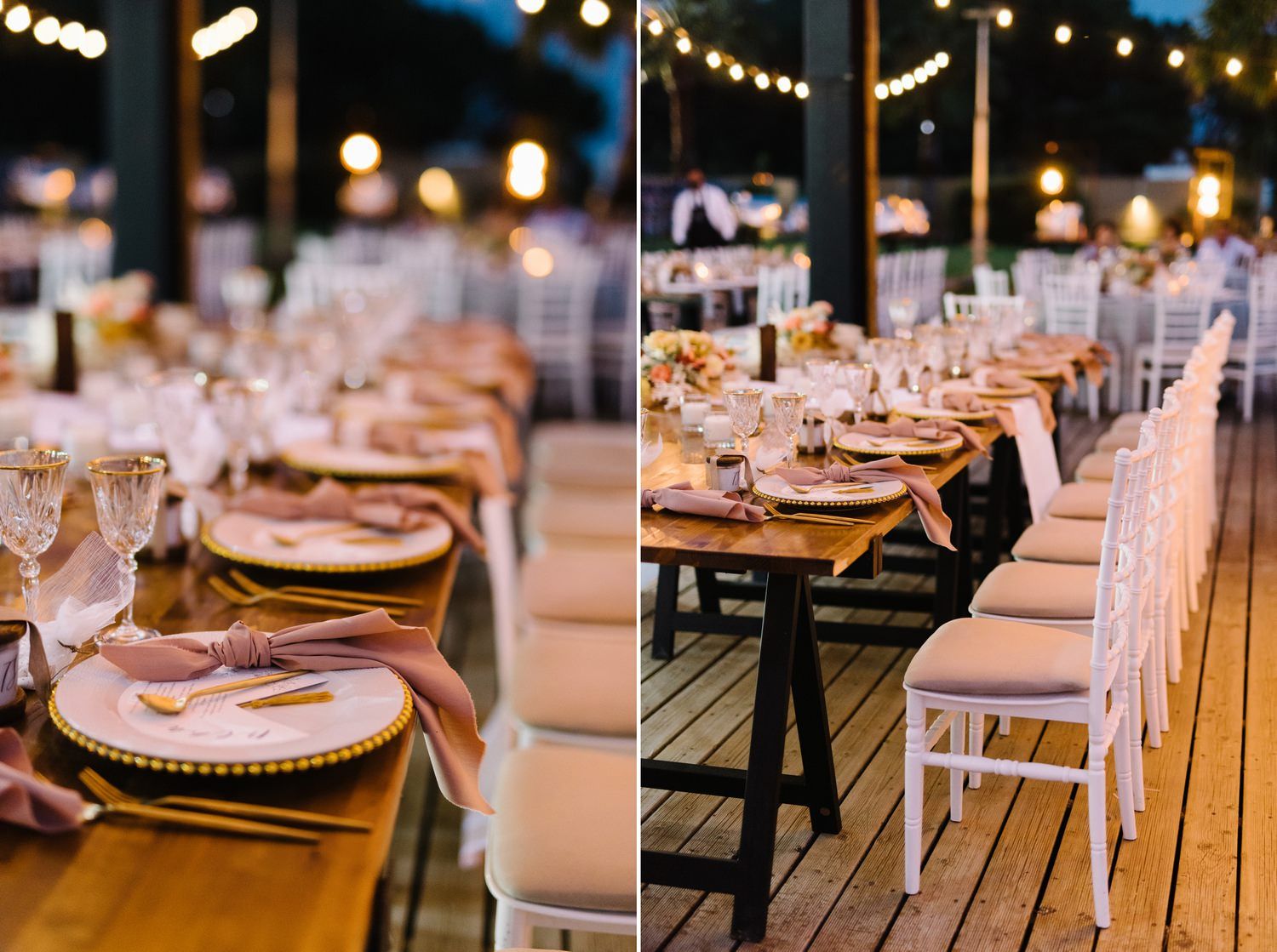 Long wooden tables set for wedding reception with white chairs and ambient string lighting.