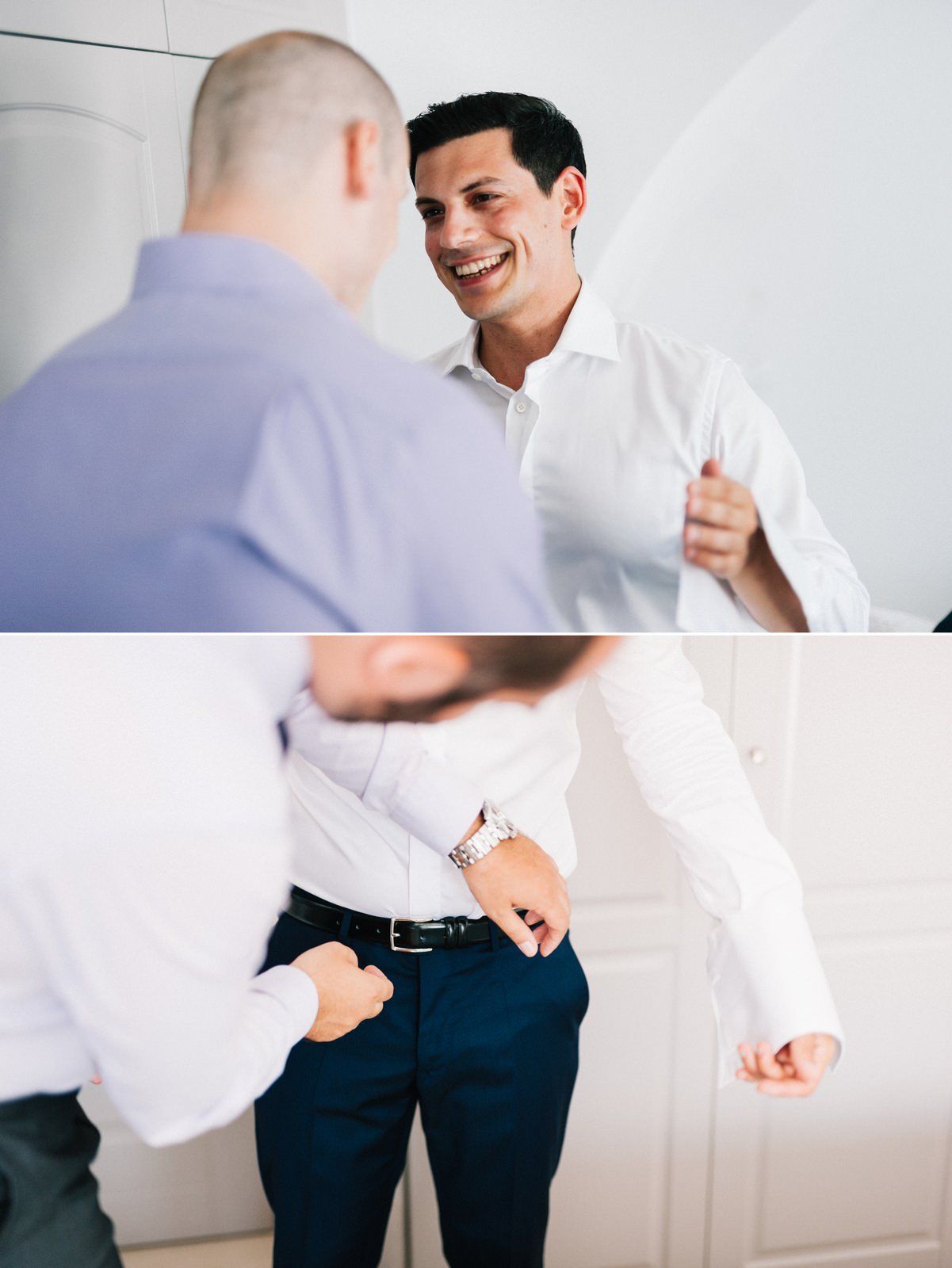 Two people interacting in a bright white room while getting dressed formally.