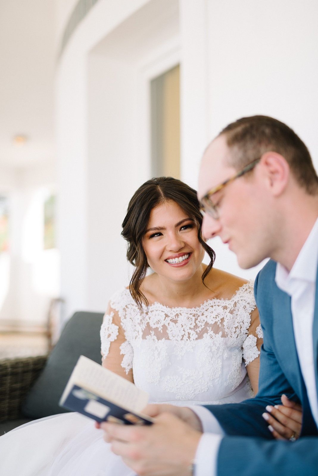 bride and groom reading their vows