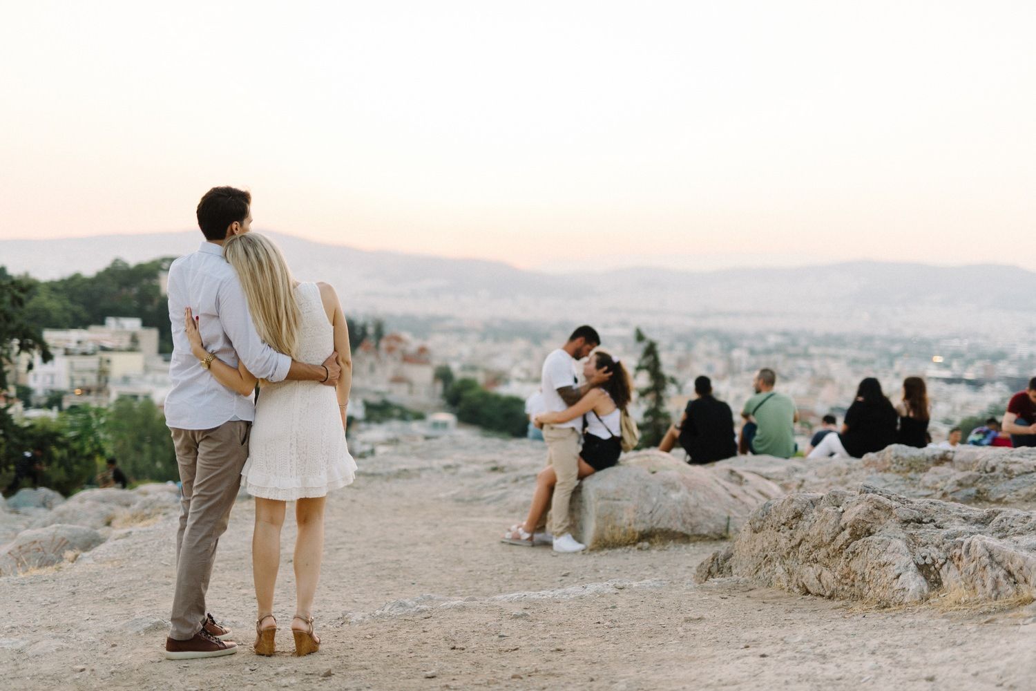 couple hug in filopappou hill athens