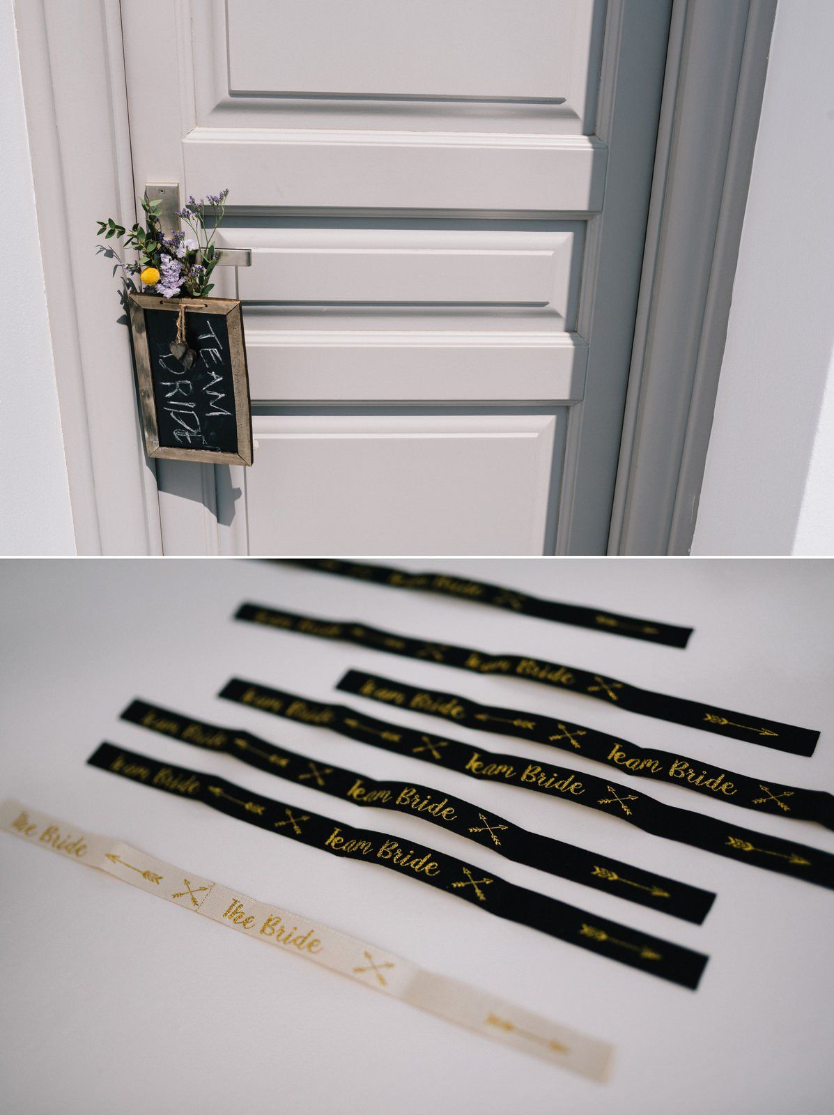 Decorative door sign and collection of black and gold ribbons arranged on white surface.