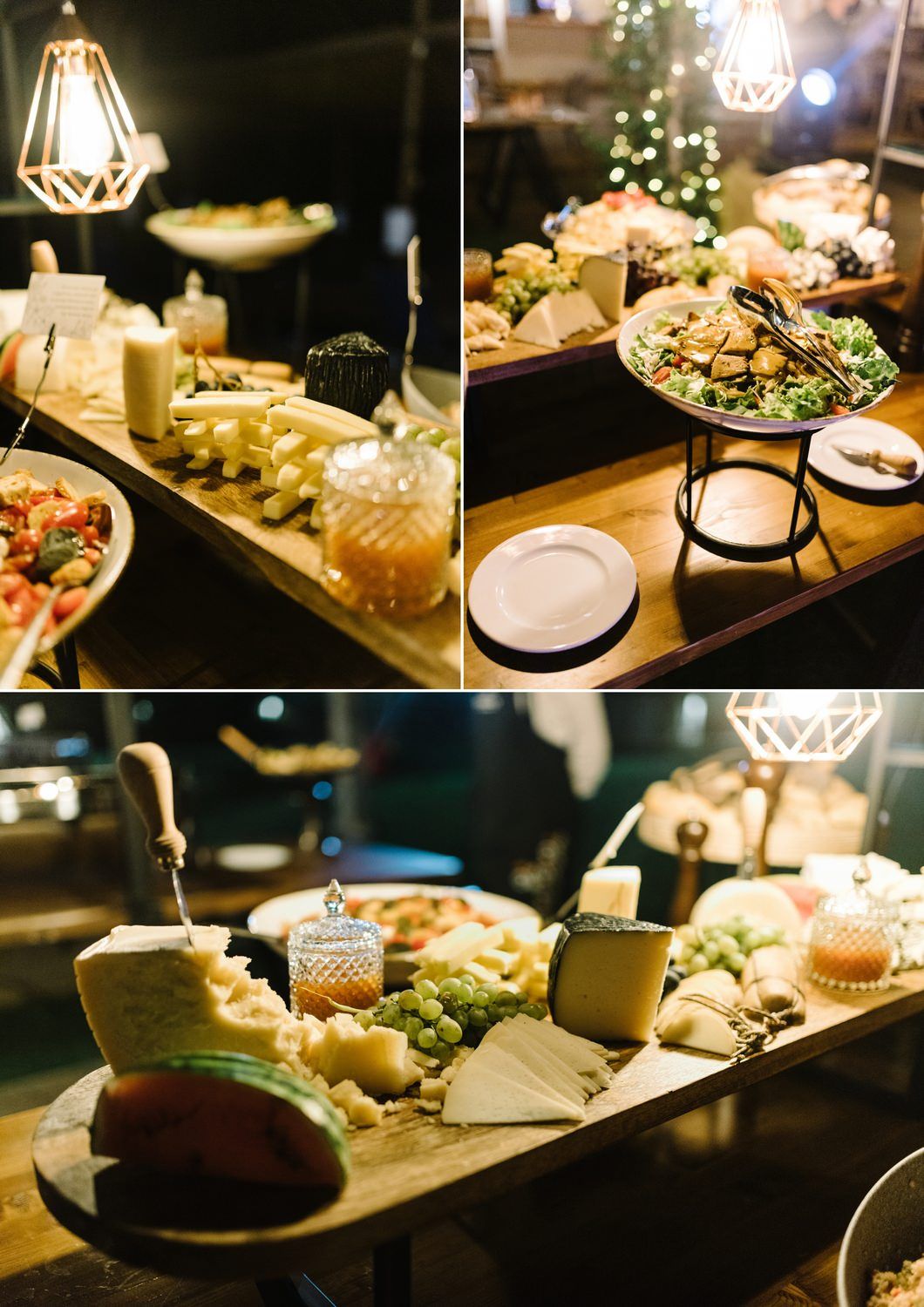 Elegant catering display with various appetizers and dishes on wooden boards under ambient lighting.