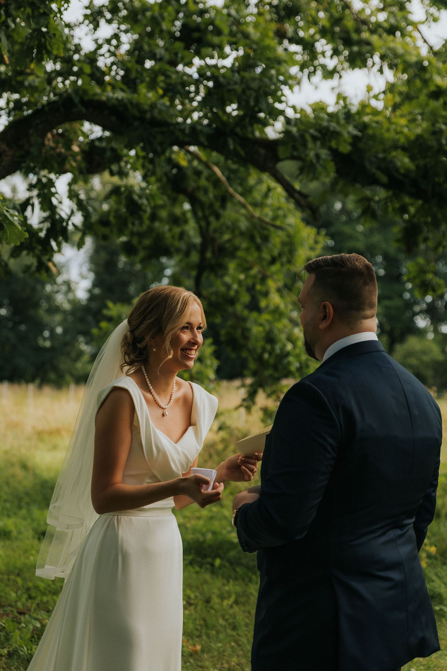 Documentary wedding photograph of bride and groom during private vow exchange in Tallinn. Wedding photographer Greete Rätsep.