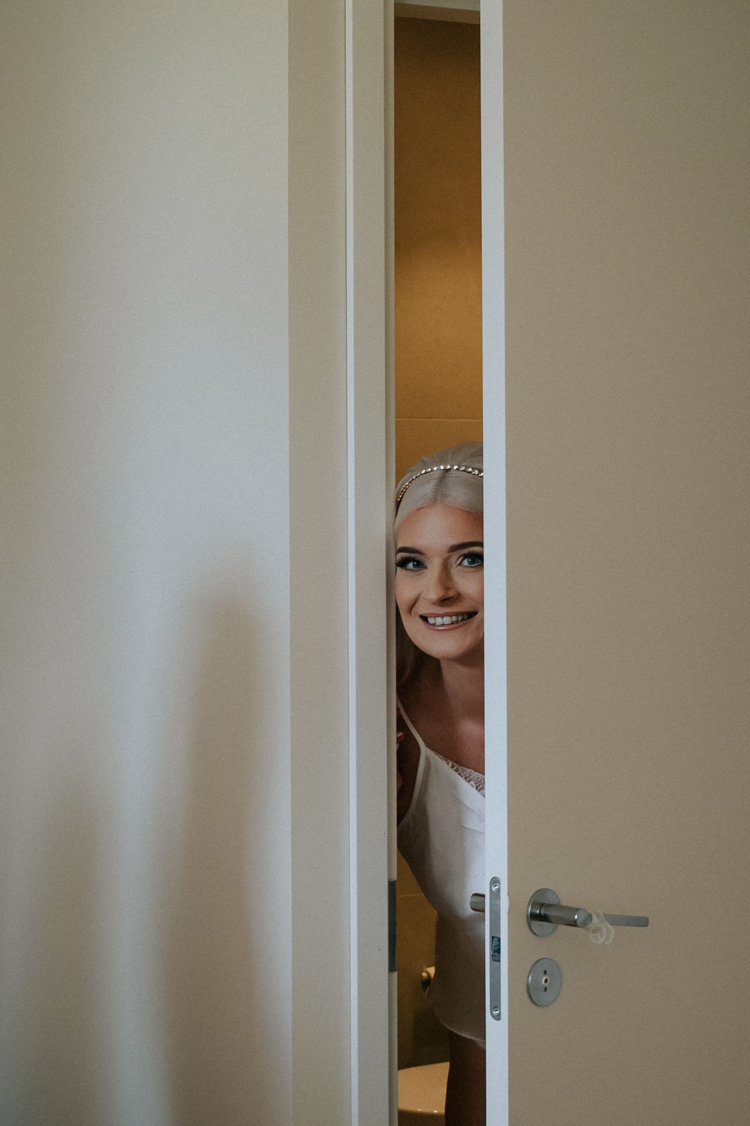 Documentary wedding photograph of bride during getting ready on her wedding morning. Wedding photographer Greete Rätsep.