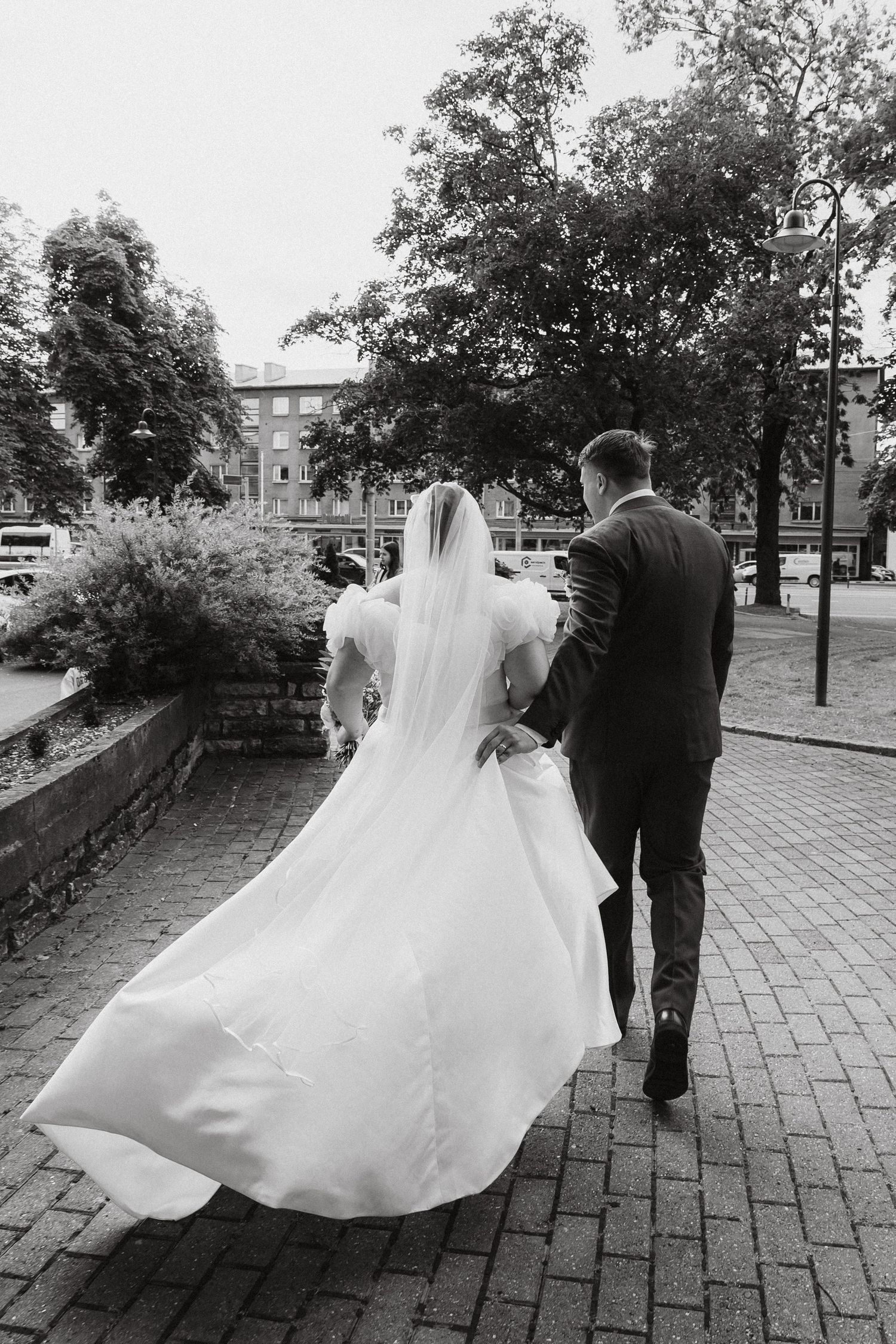 Documentary wedding photograph of bride and groom in Tallinn. Wedding photographer Greete Rätsep.
