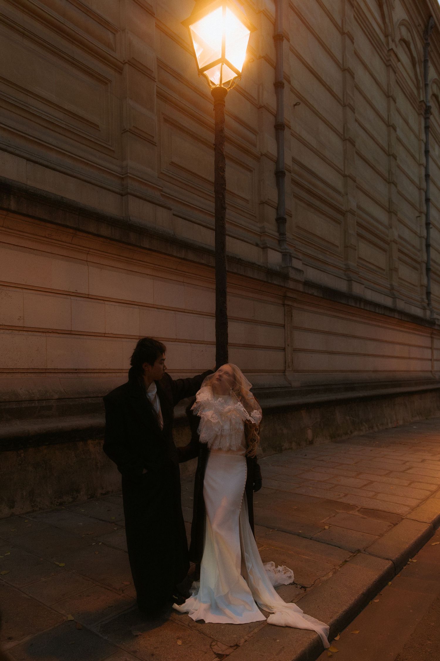 Romantic couple portrait in Paris during a moody November evening destination wedding shoot
