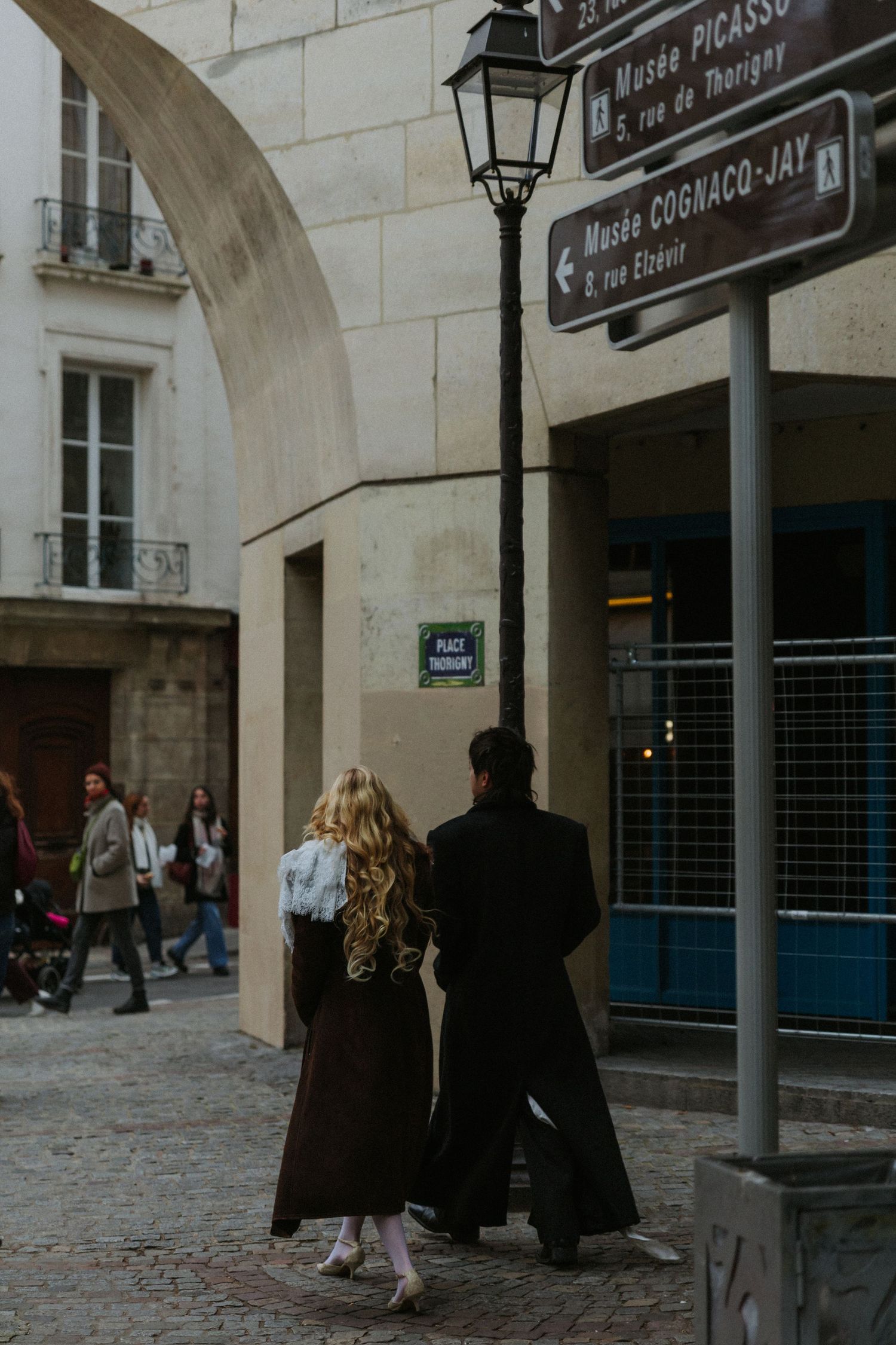 Romantic couple portrait in Paris during a moody November evening destination wedding Paris