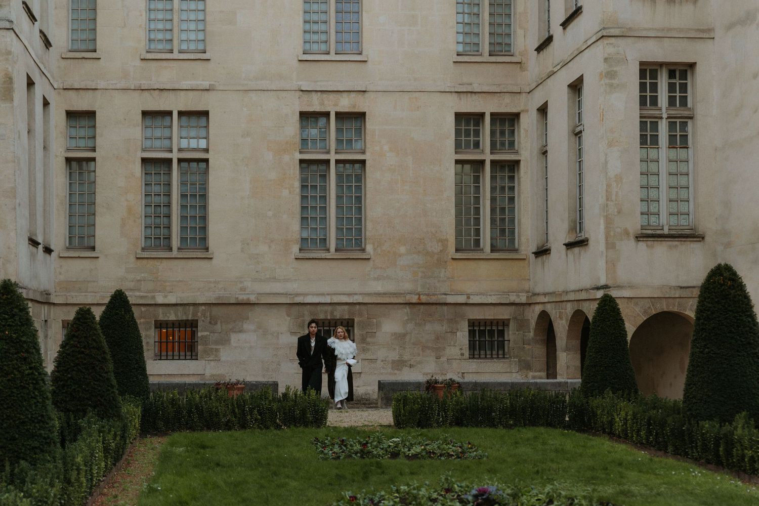 Romantic couple portrait in Paris during a moody November evening destination wedding shoot