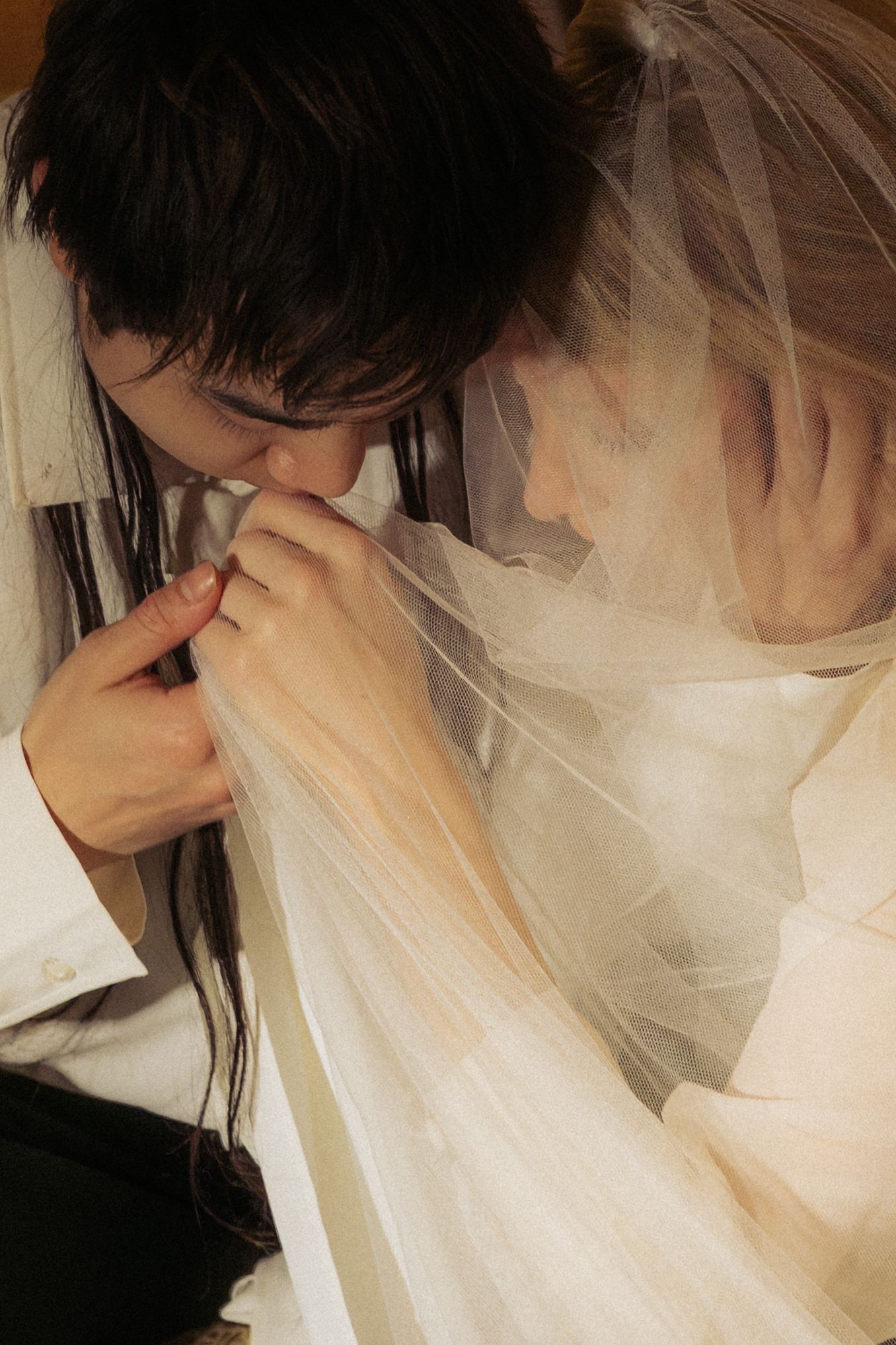 Romantic couple portrait in Paris during a moody November evening destination wedding shoot