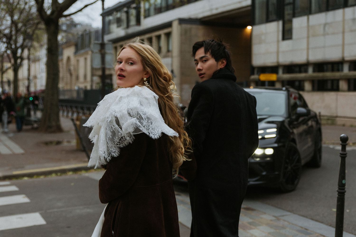 Romantic couple portrait in Paris during a moody November evening destination wedding shoot