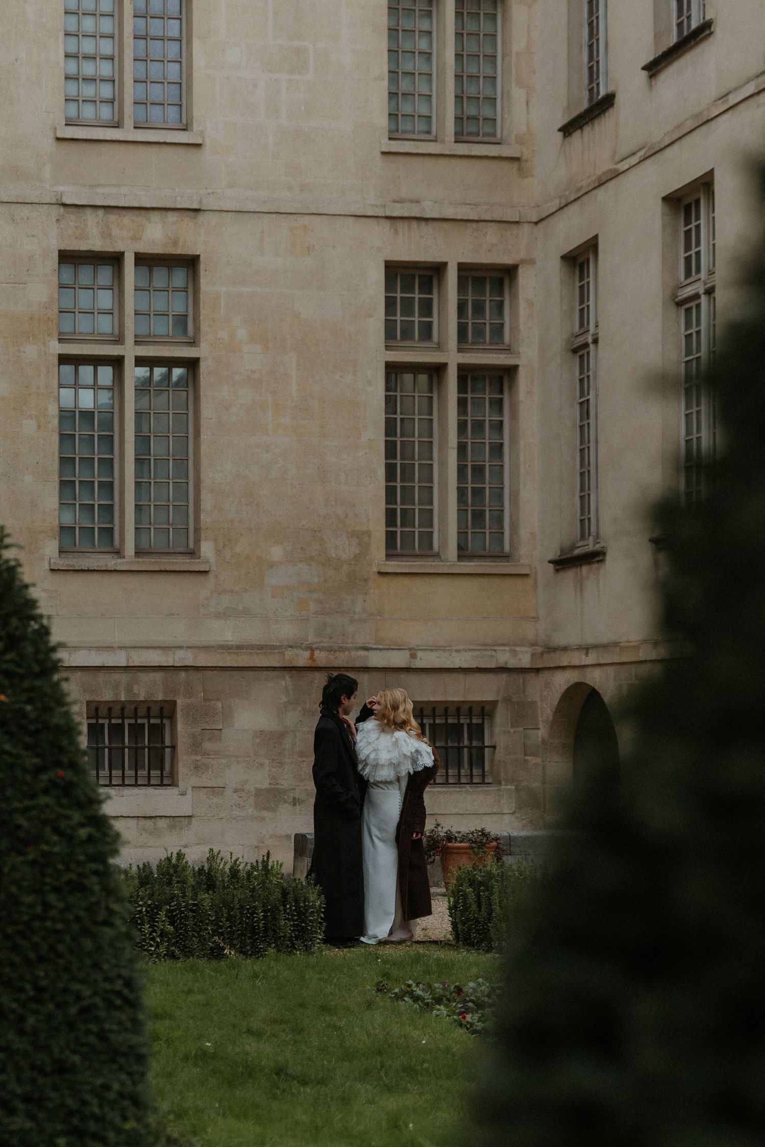 Romantic couple portrait in Paris during a moody November evening destination wedding shoot