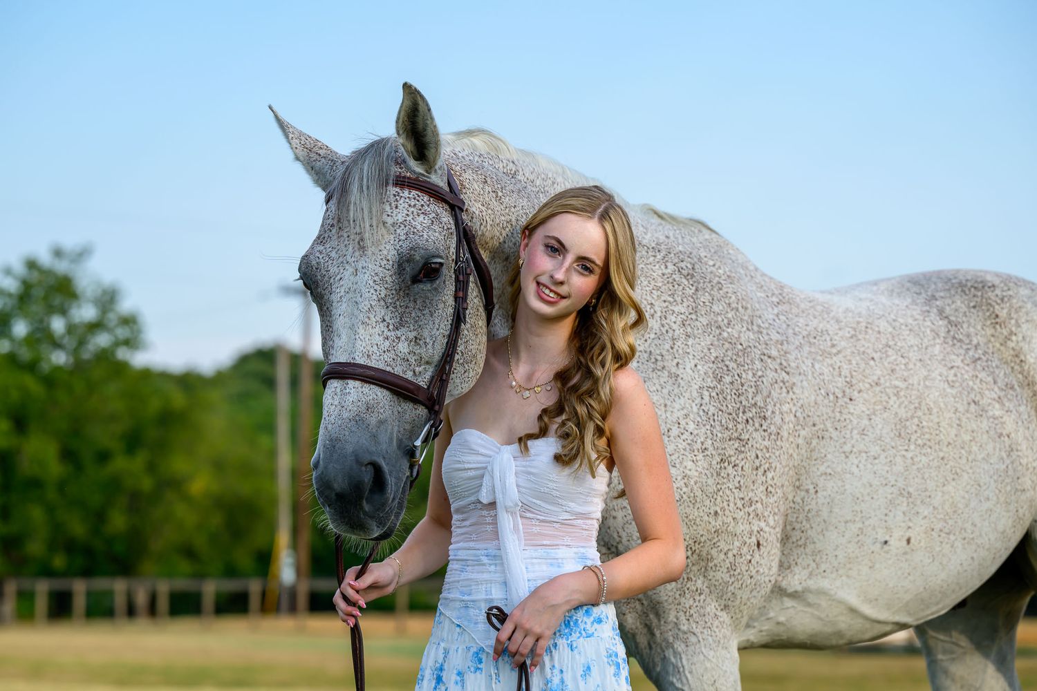 High school senior equestrian portrait with horse — captured in natural Texas light.