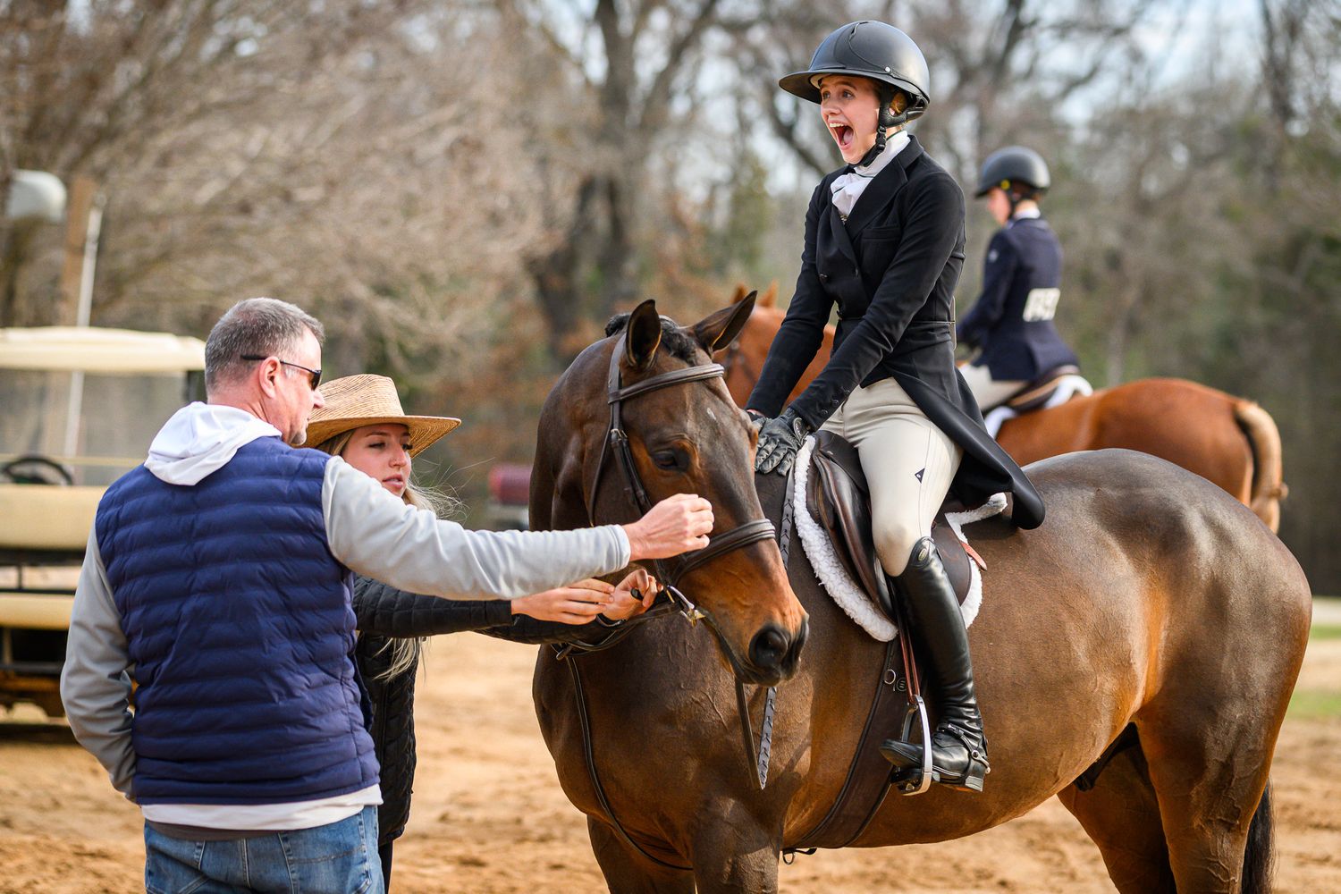Rider celebrating a winning round with her horse and family at Texas Rose Horse Park taken by private show photographer Sean Stacey.