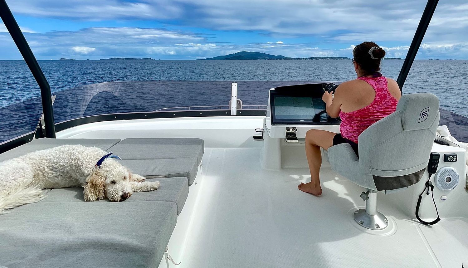 A series of photos showing people relaxing on a boat deck with scenic ocean and mountain views in the background.