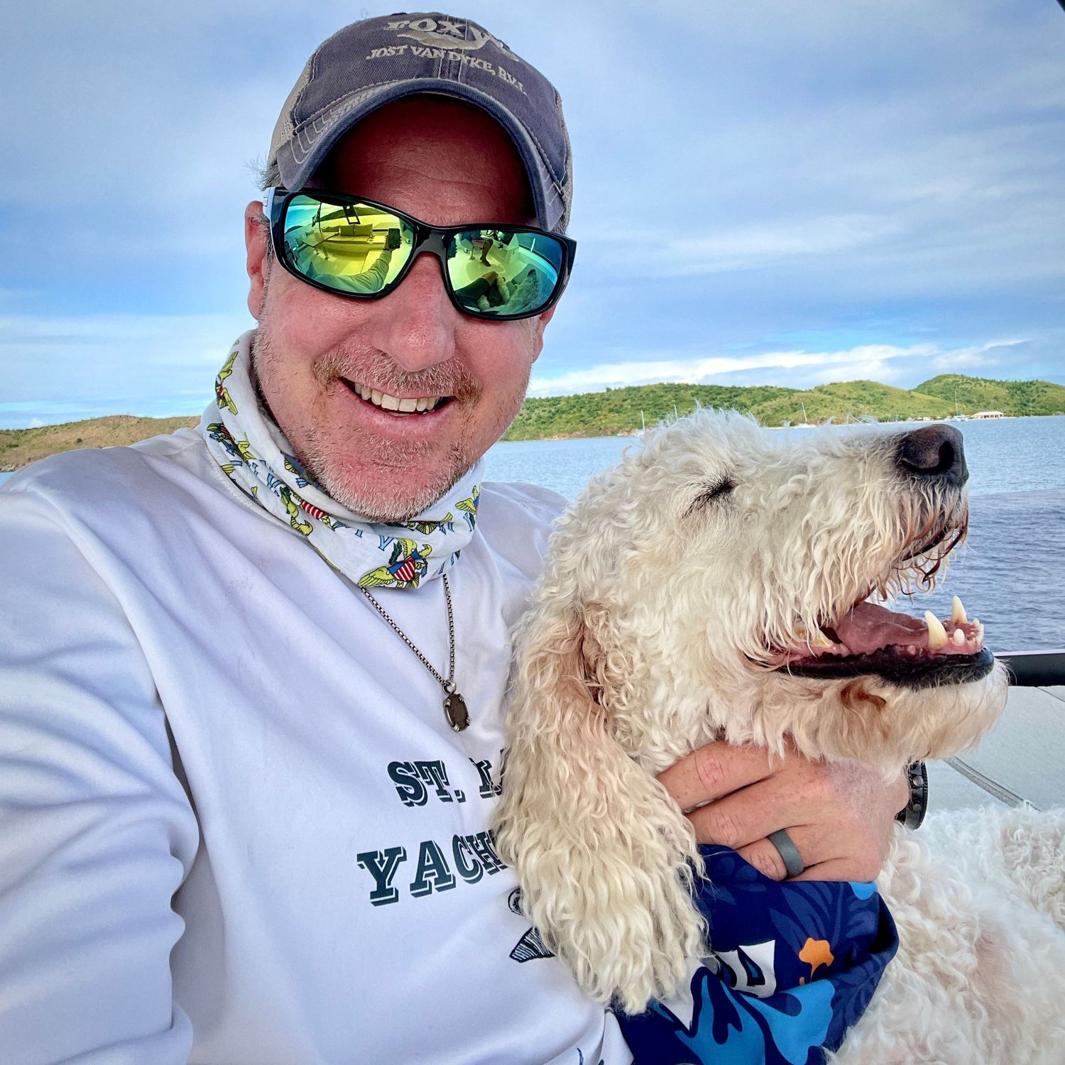 Texas based horse photographer, Sean Stacey, enjoying time on a boat in the USVI with his dog Barley.