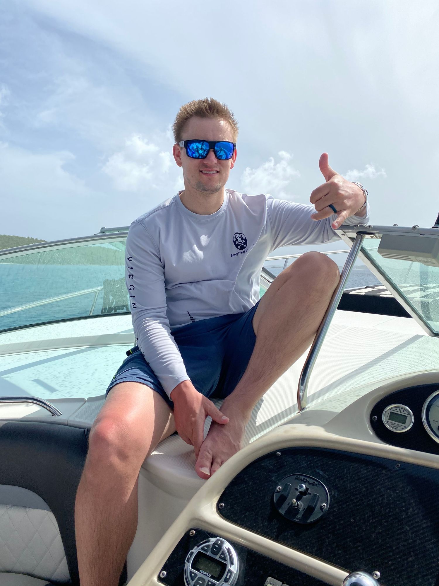 A series of photos showing someone at the helm of a boat on a sunny day wearing sunglasses and casual attire.