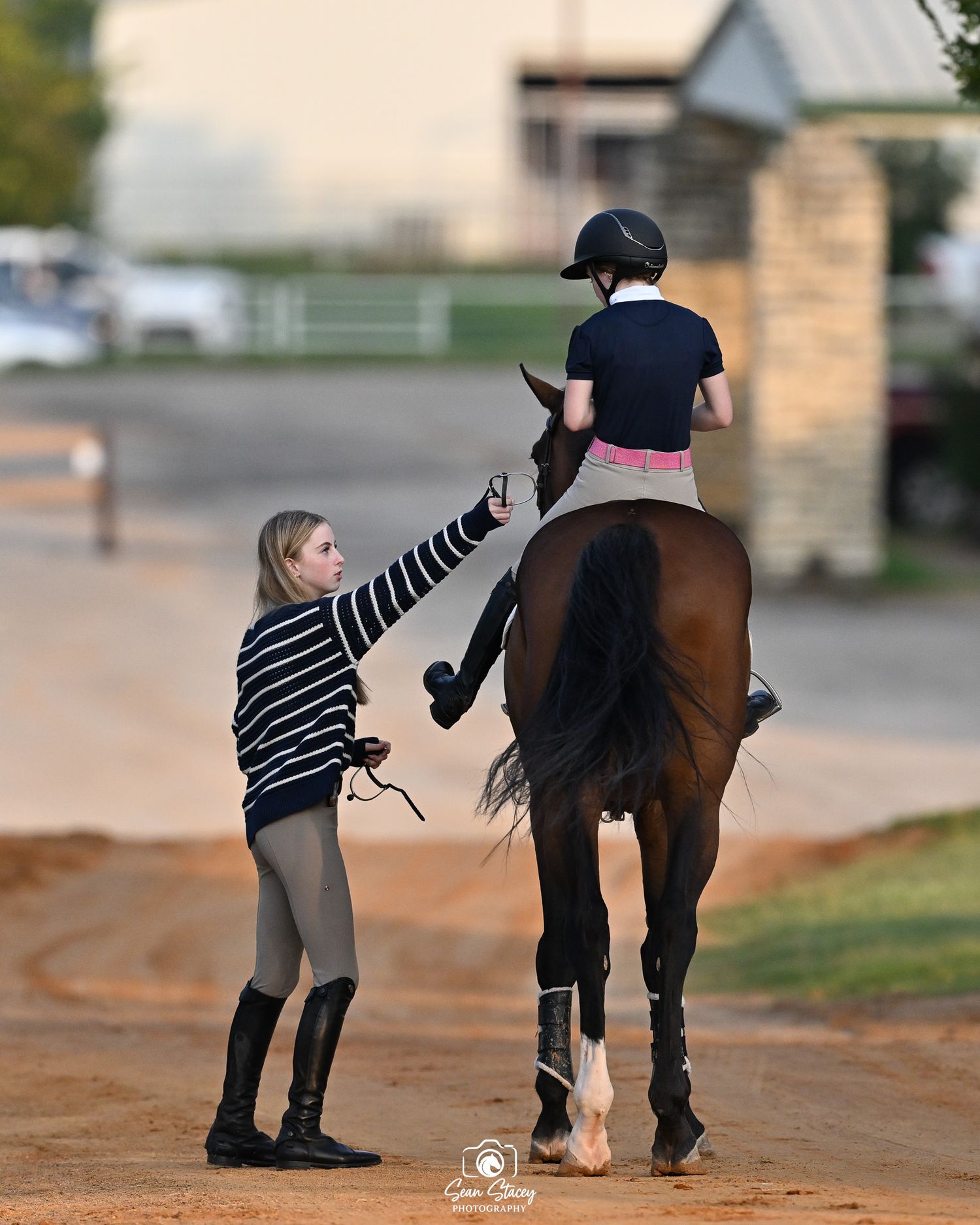 Candid, behind-the-scenes moment from horse show at Texas Rose Horse Park taken by Sean Stacey.