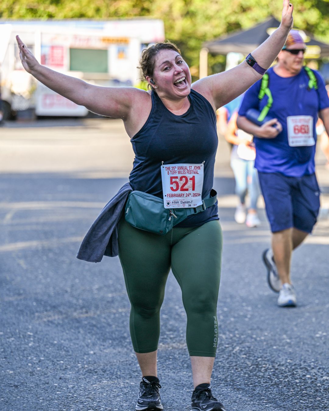 A sequence of photos showing a runner in green shorts celebrating enthusiastically during the annual 8 Tuff Miles race on St. John, USVI.