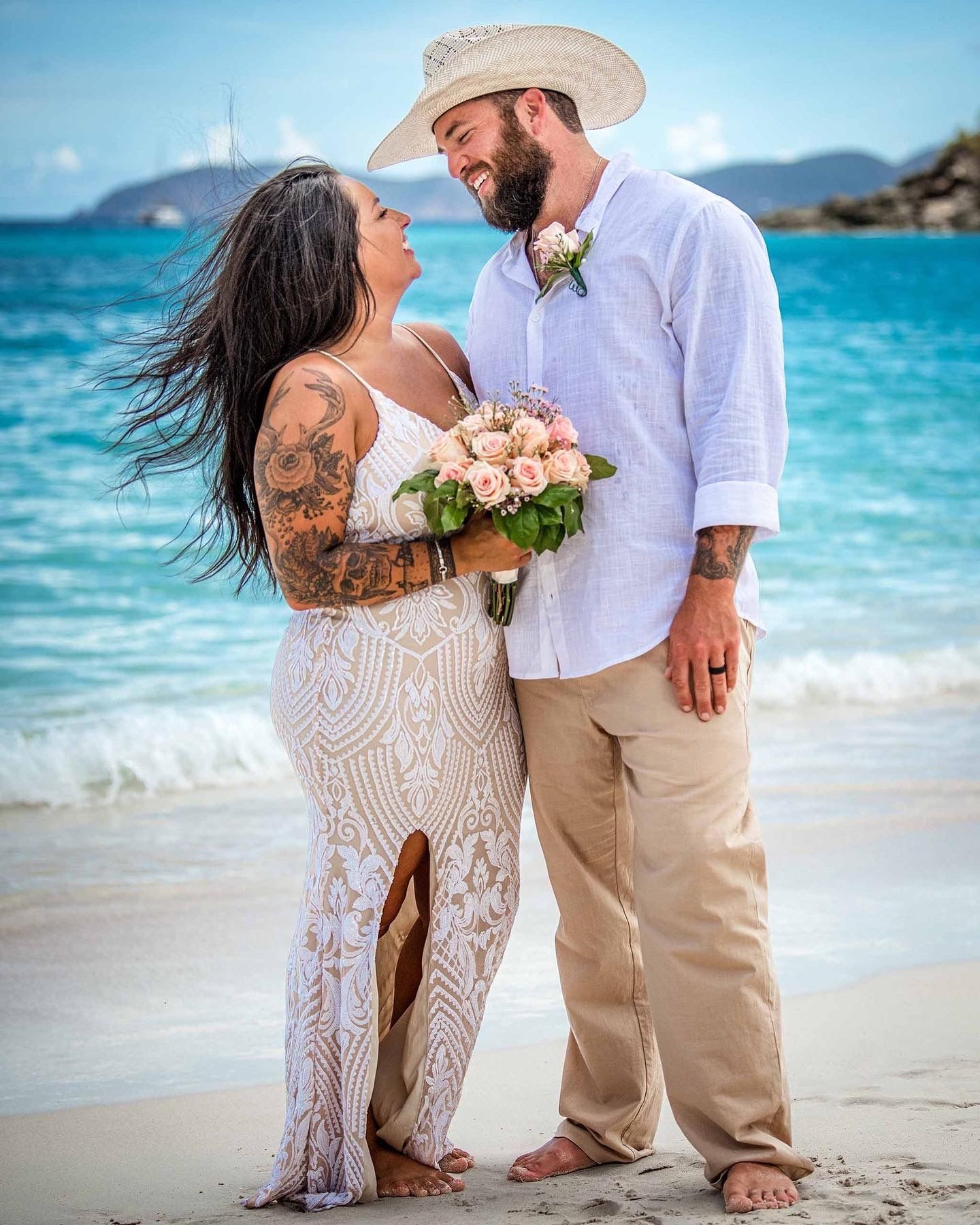 Couple embracing on St. John beach — love and storytelling through Sean Stacey’s lens.