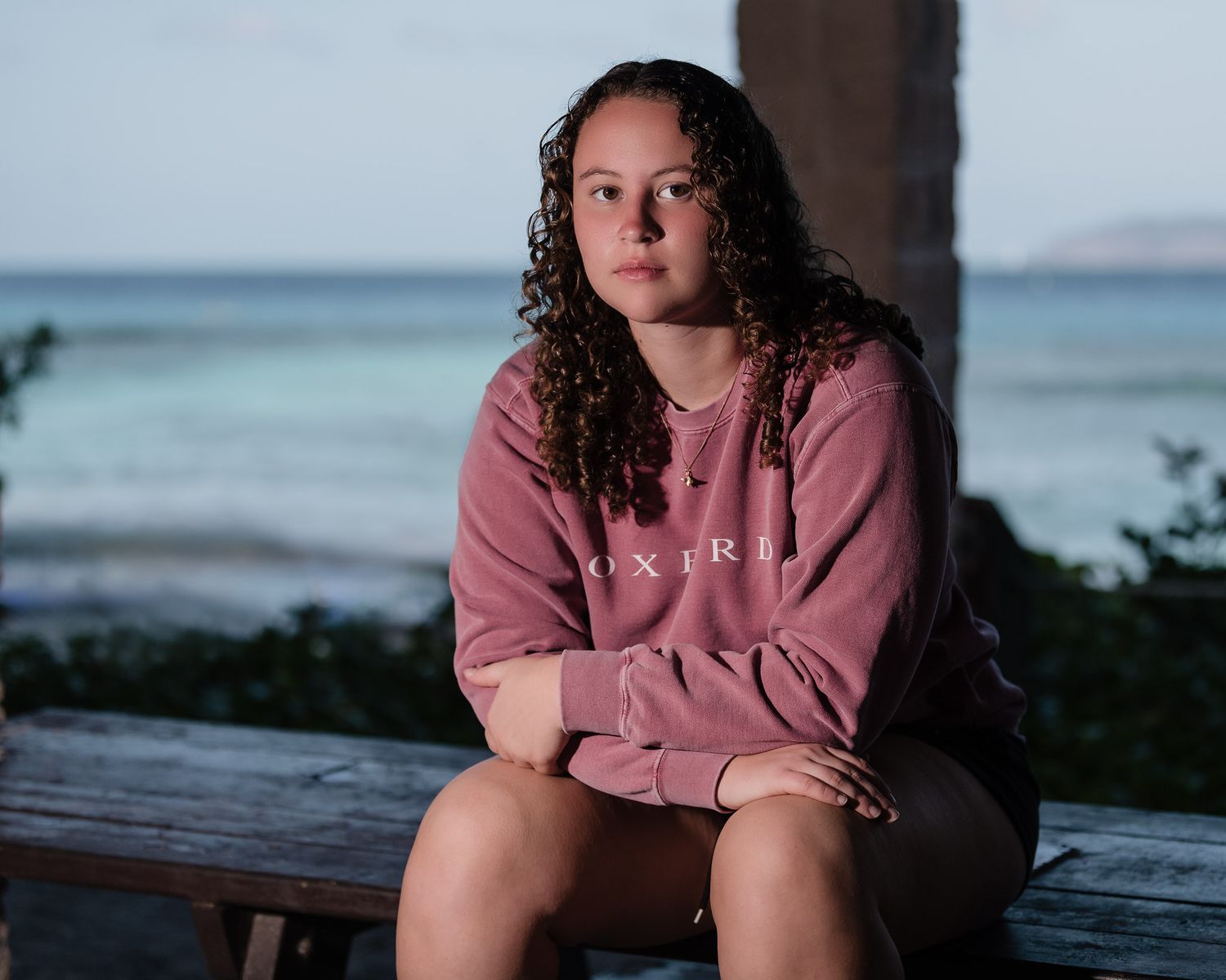 Editorial-style senior portrait with soft pastel tones taken in Cinnamon Bay, St. John.