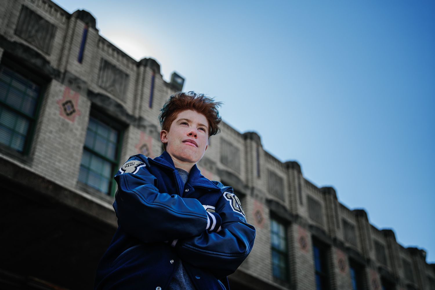 Artistic senior portrait using dramatic shadows and fine-art retouching signature to Sean Stacey Photography.