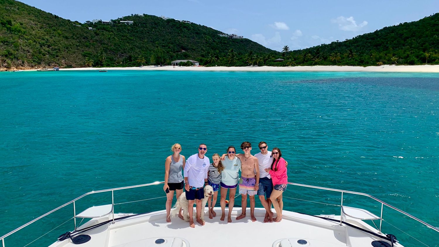 Friends & family on a boat in turquoise Virgin Islands water — joy and connection that sparked Sean Stacey’s artistry.