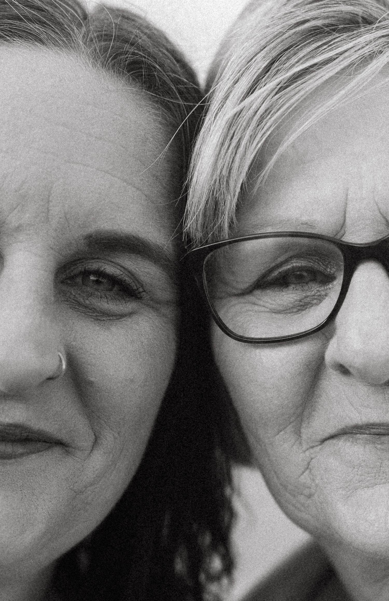 Intimate black and white close-up portrait showing connection and joy.