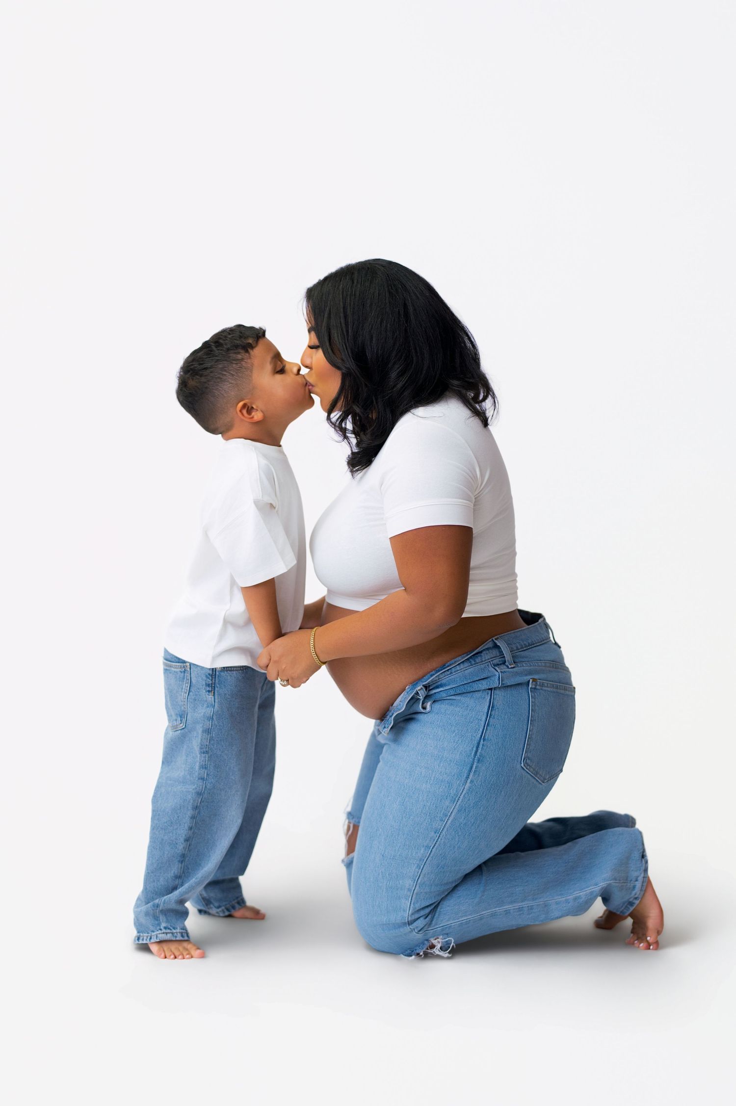 Three sequential photos show a tender moment between parent and child in matching white shirts and blue jeans.
