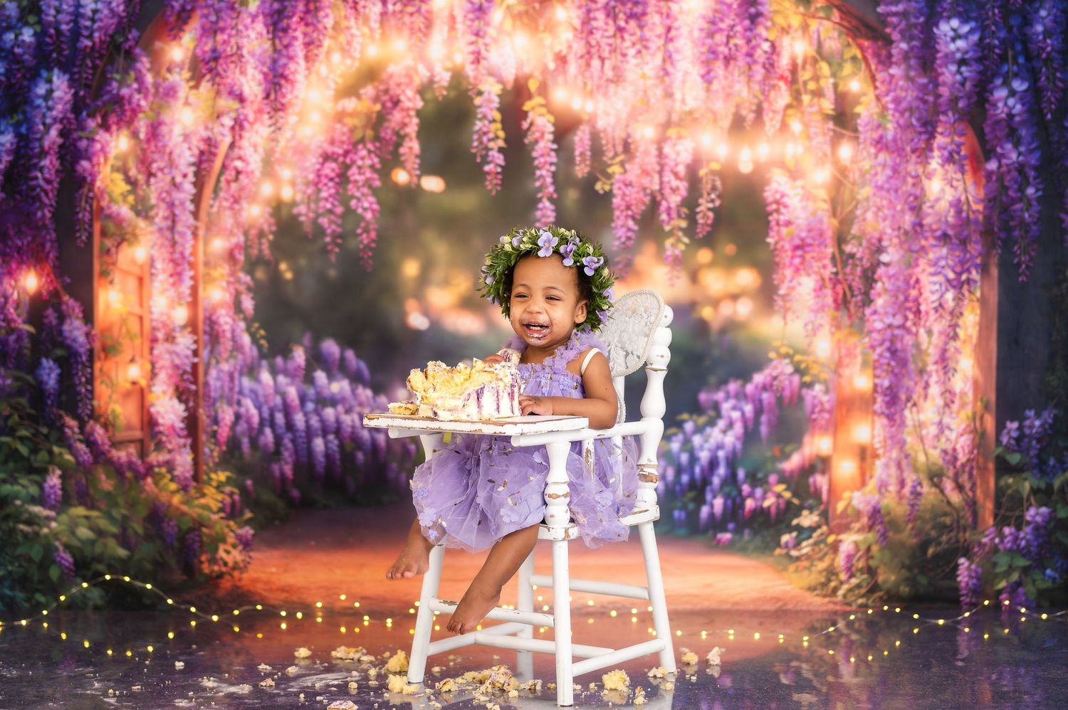 Dreamy purple wisteria backdrop with twinkling lights for fairy themed photography session.