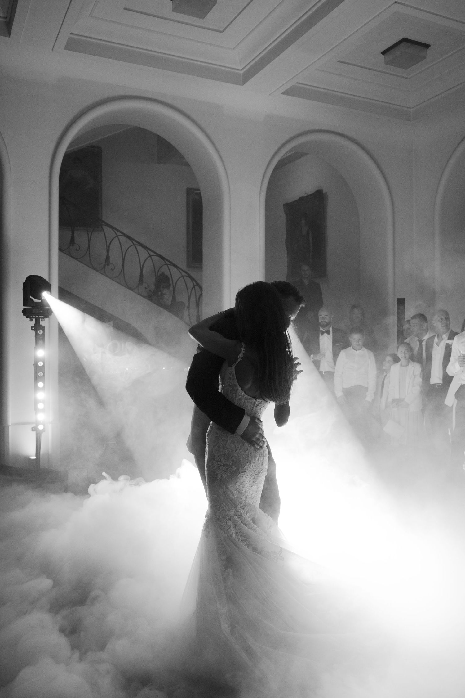 Dramatic first dance scene with fog effects in an elegant ballroom setting.