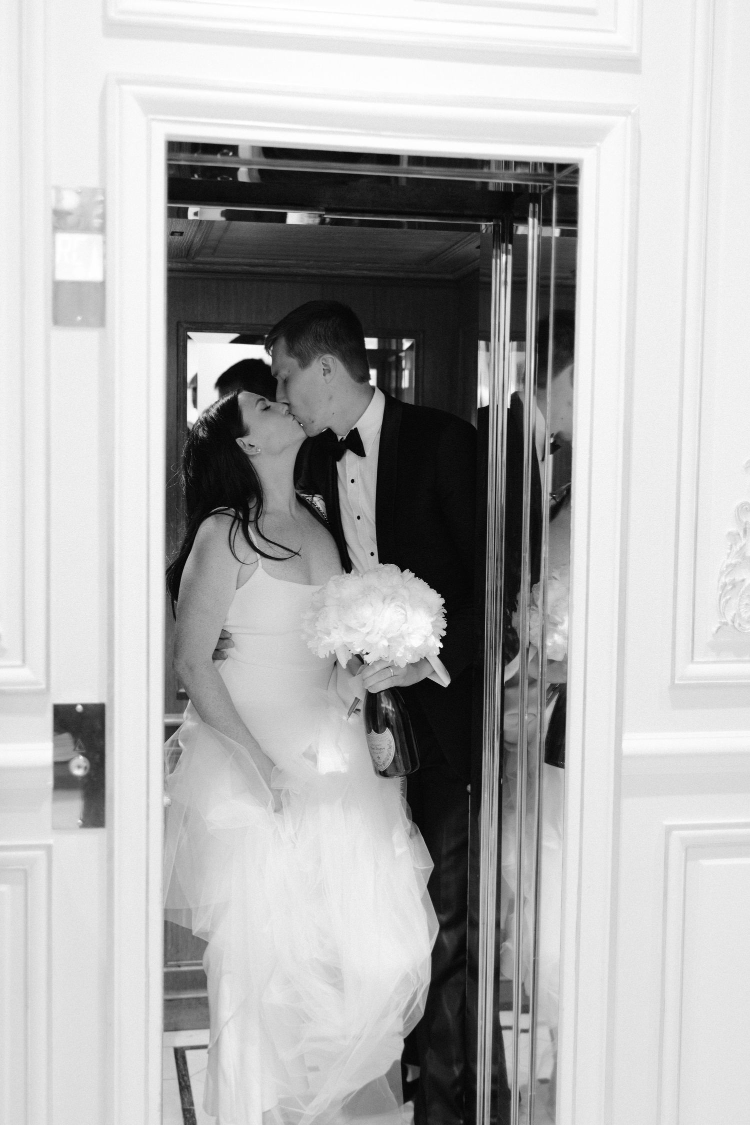 An elegant wedding entrance sequence showing movement through white doors.