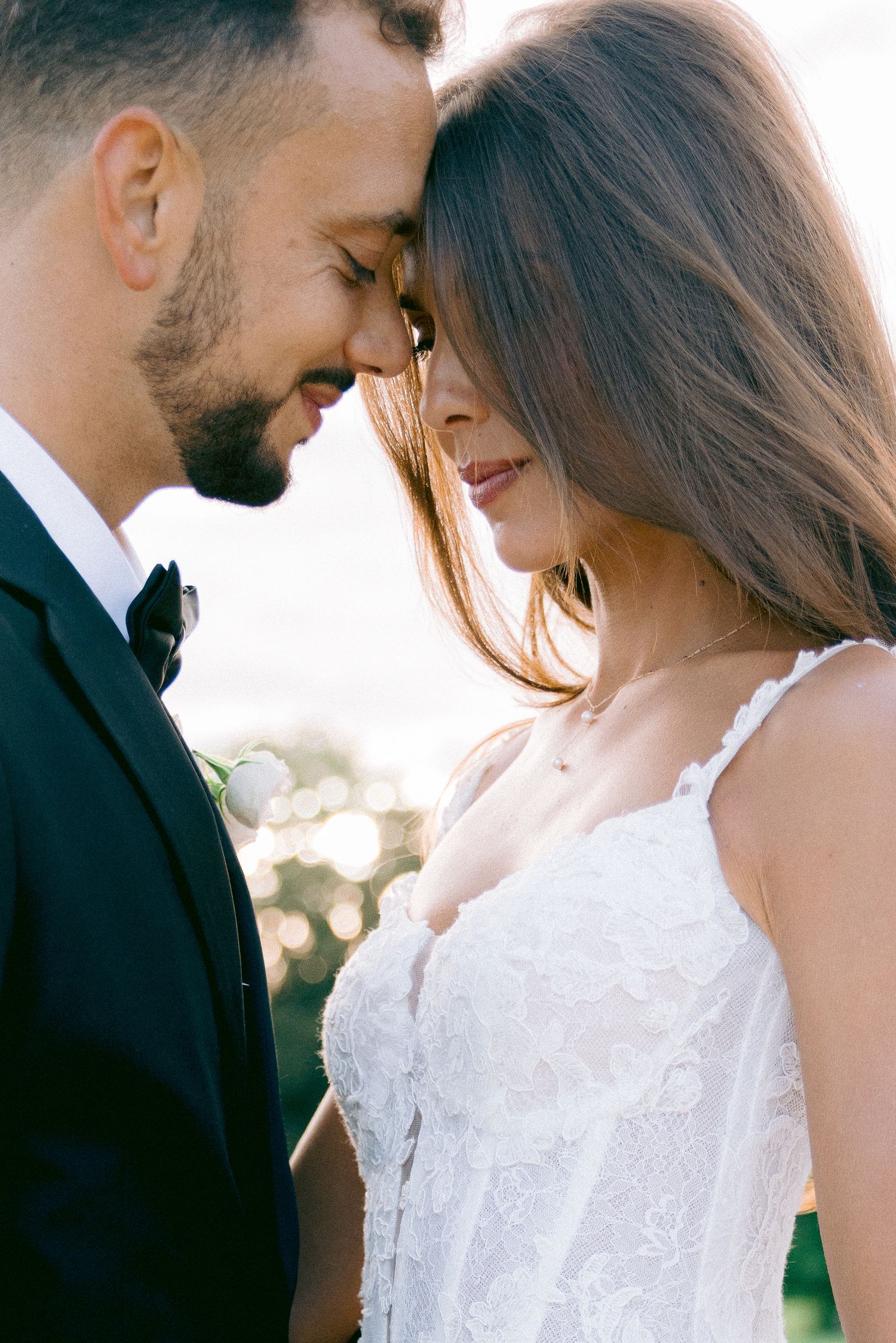Intimate wedding portrait captured in soft natural light outdoors at Château de Sept Saulx