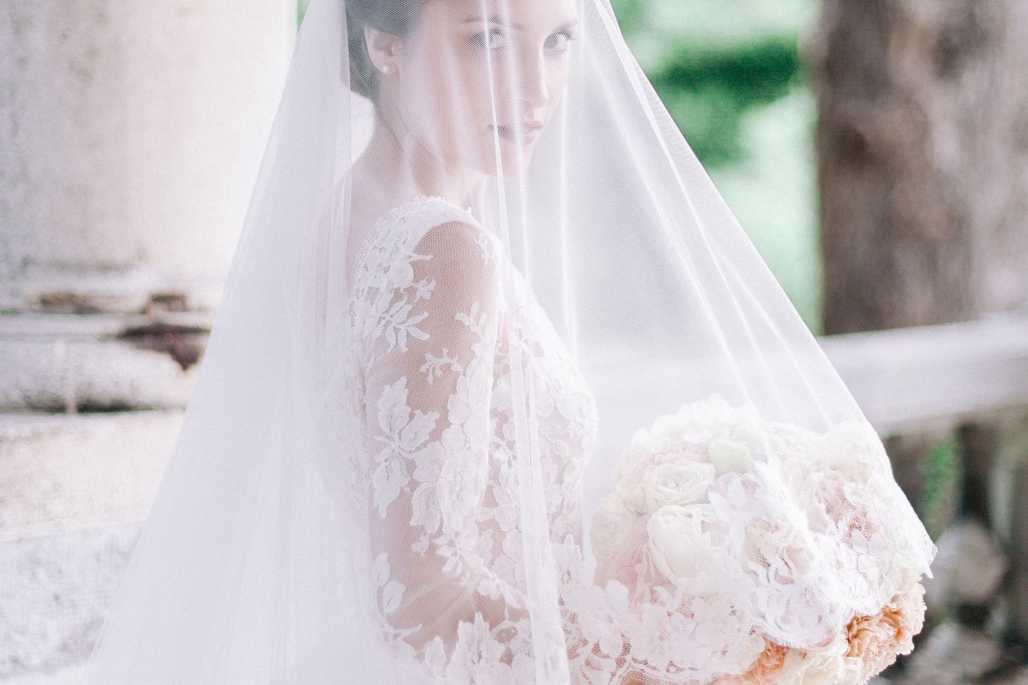 Delicate veil details with intricate lace edges in soft natural light.