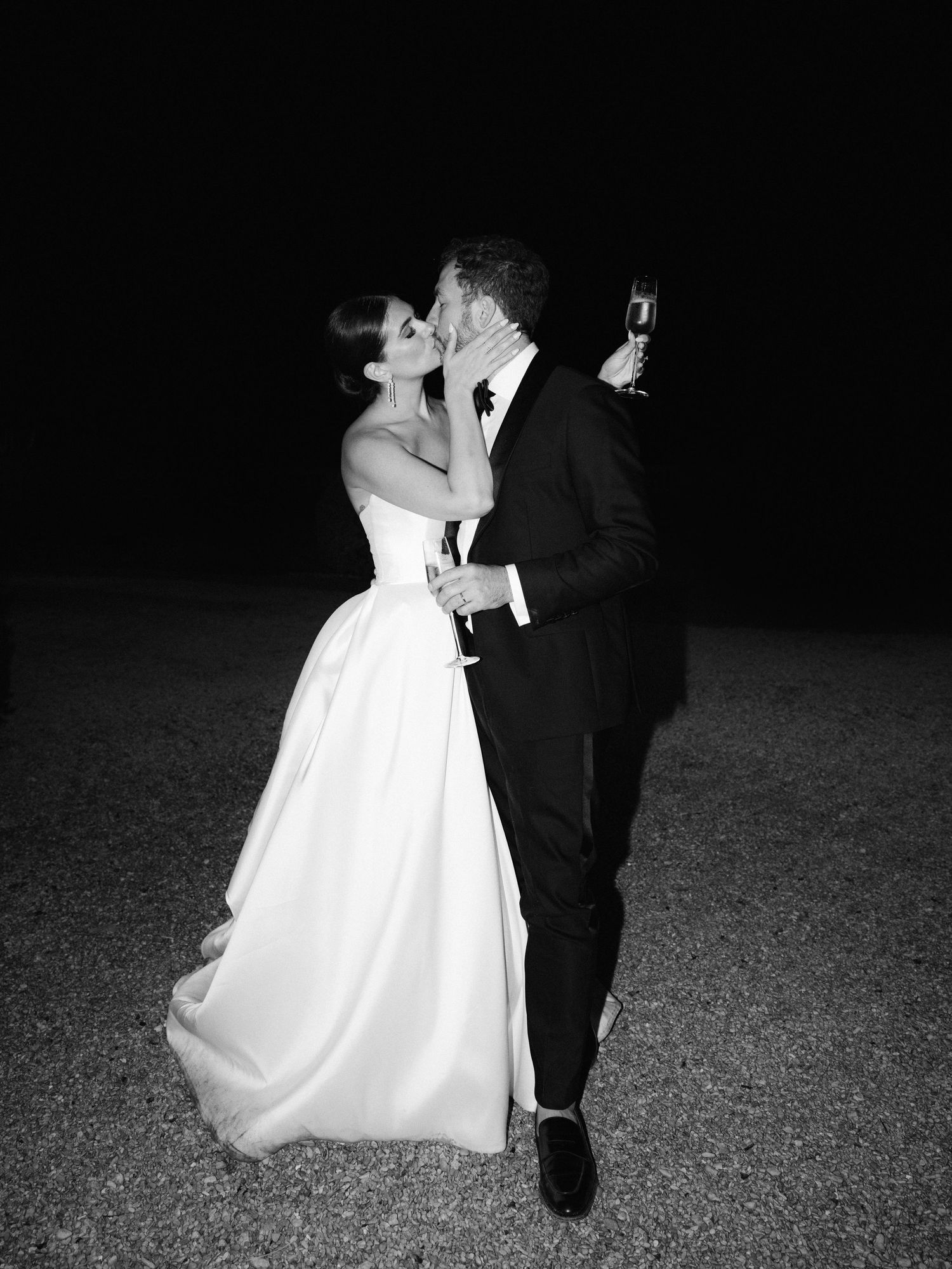 Black and white photos of couple dancing together at nighttime wedding reception.